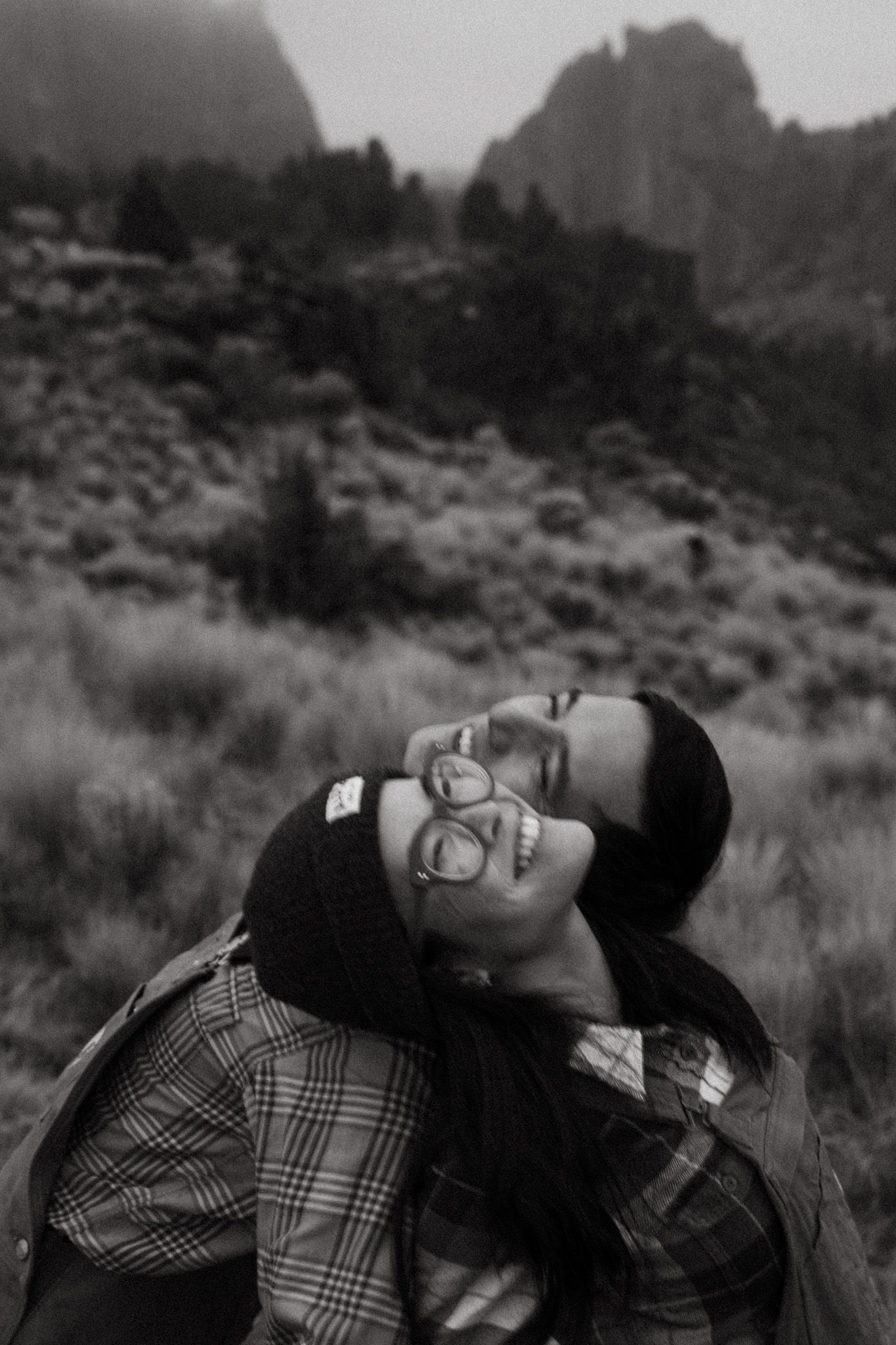 Goofy black and white photo of a couple dancing together by Smith Rock state park