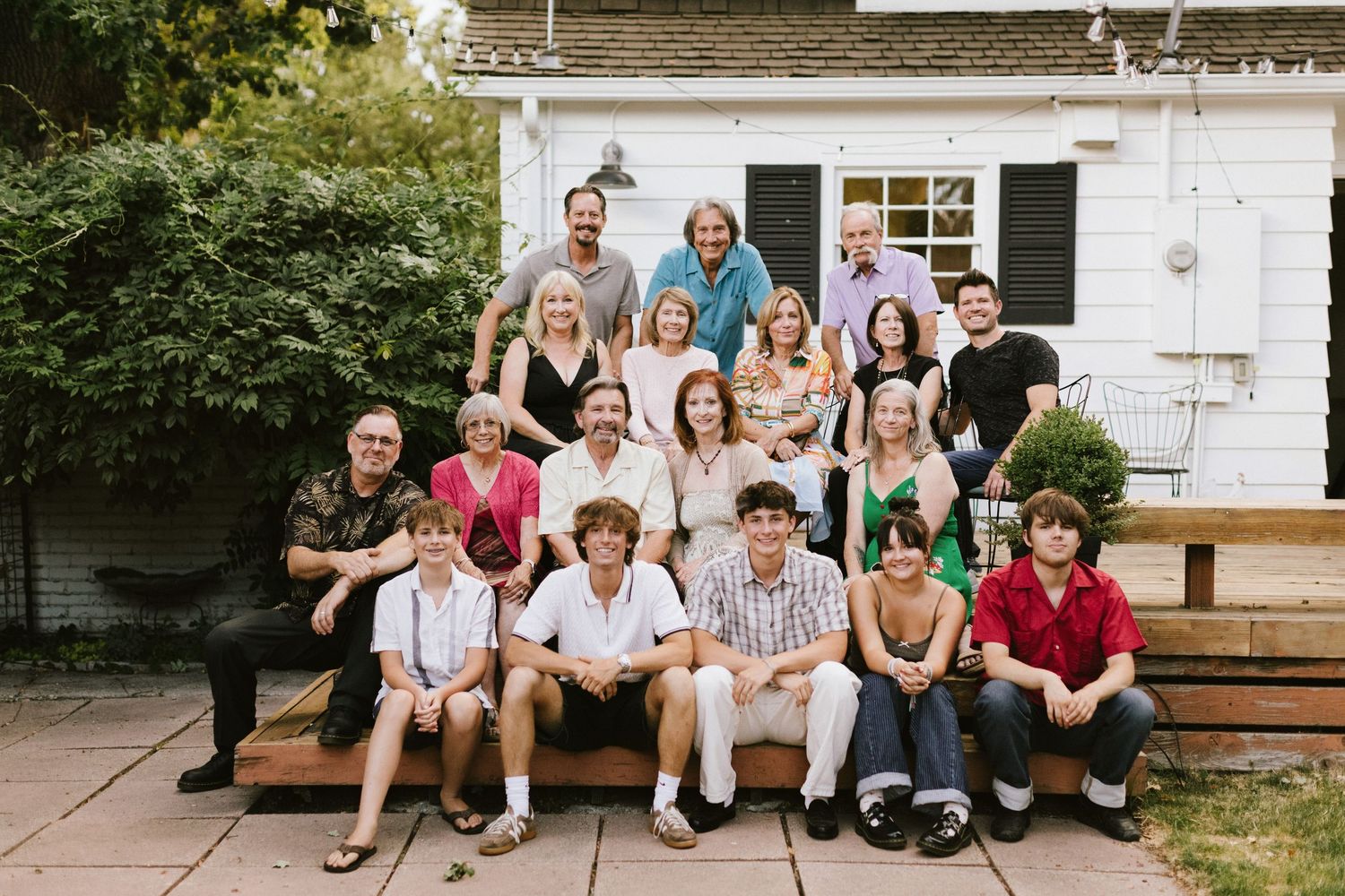 Extended family sitting together for a photoshoot in the summer near Boise