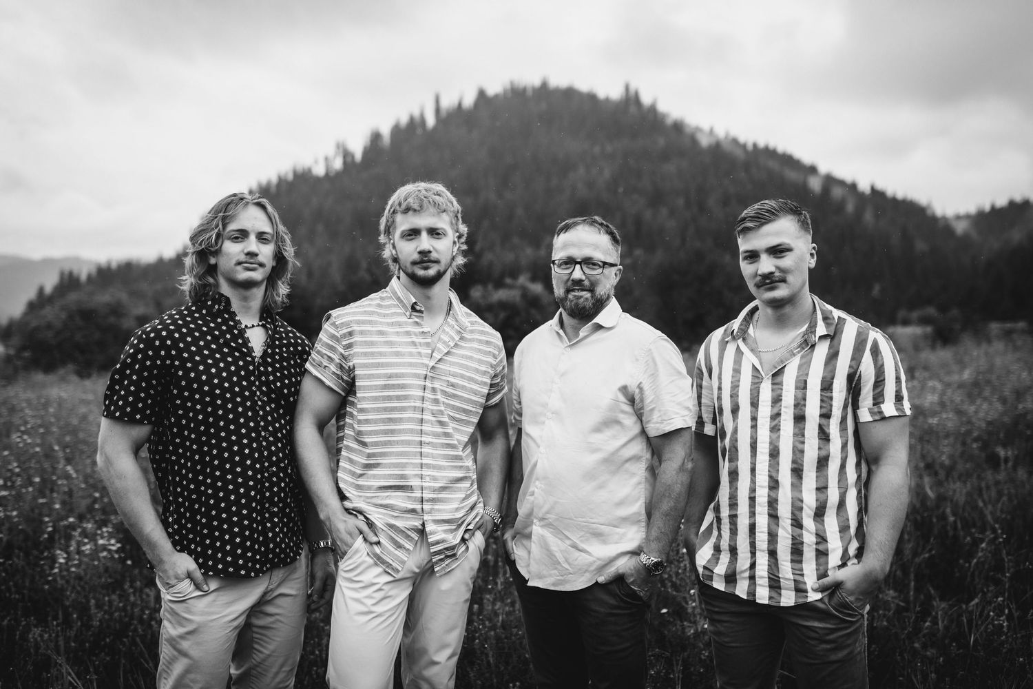 Dad and sons standing for family portraits