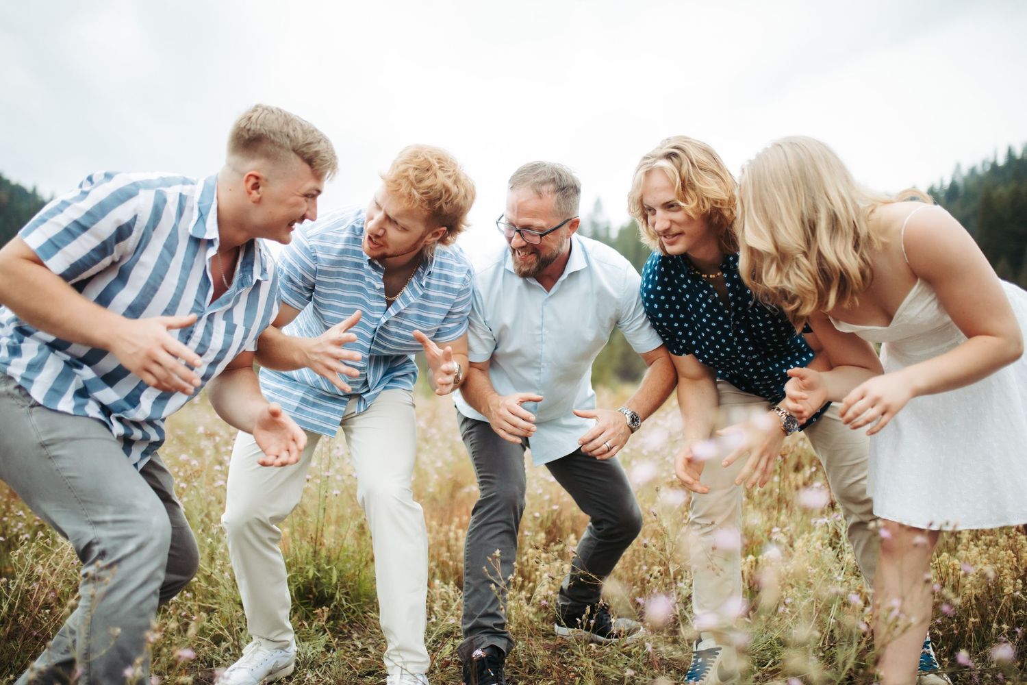 Dad and kids playing together for family photos