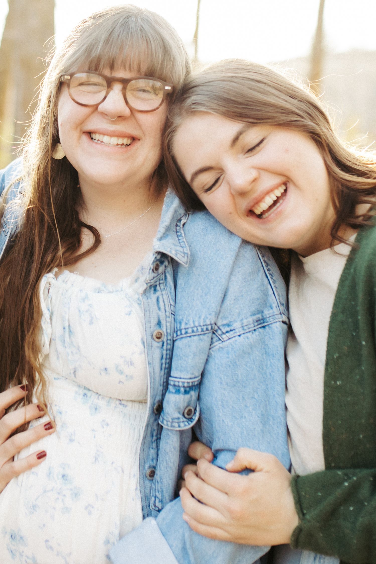 Candid family photograph of sisters laughing