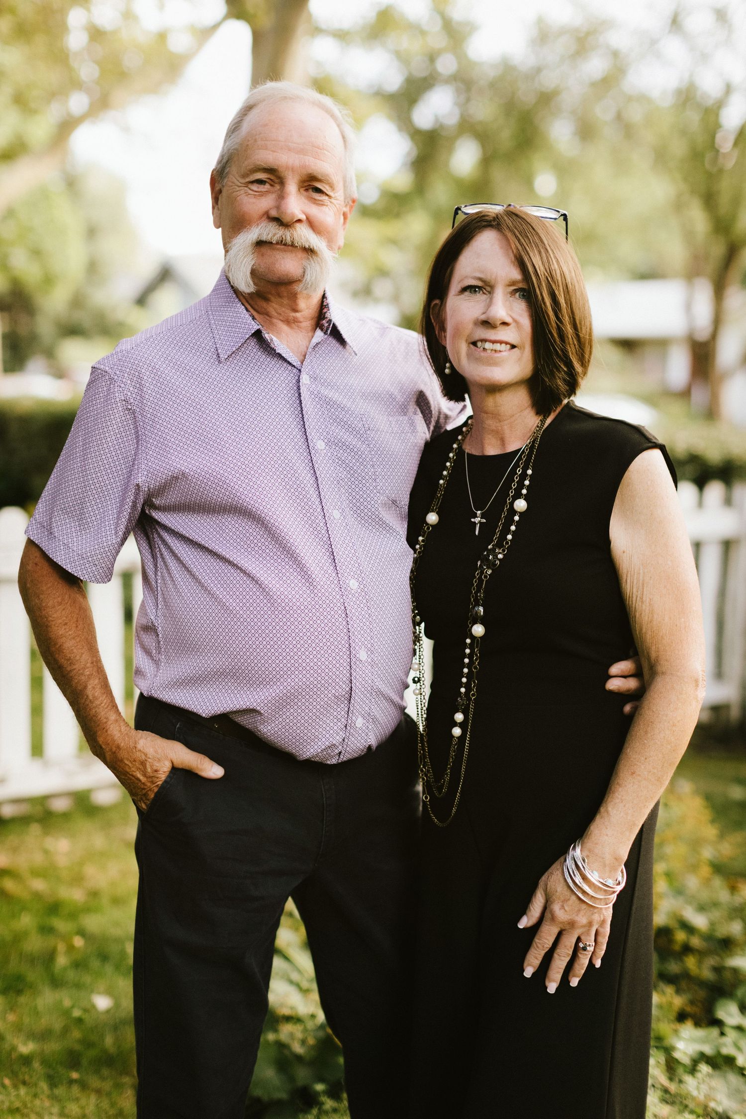 Couple posing closely together during a family photoshoot in the Boise North End