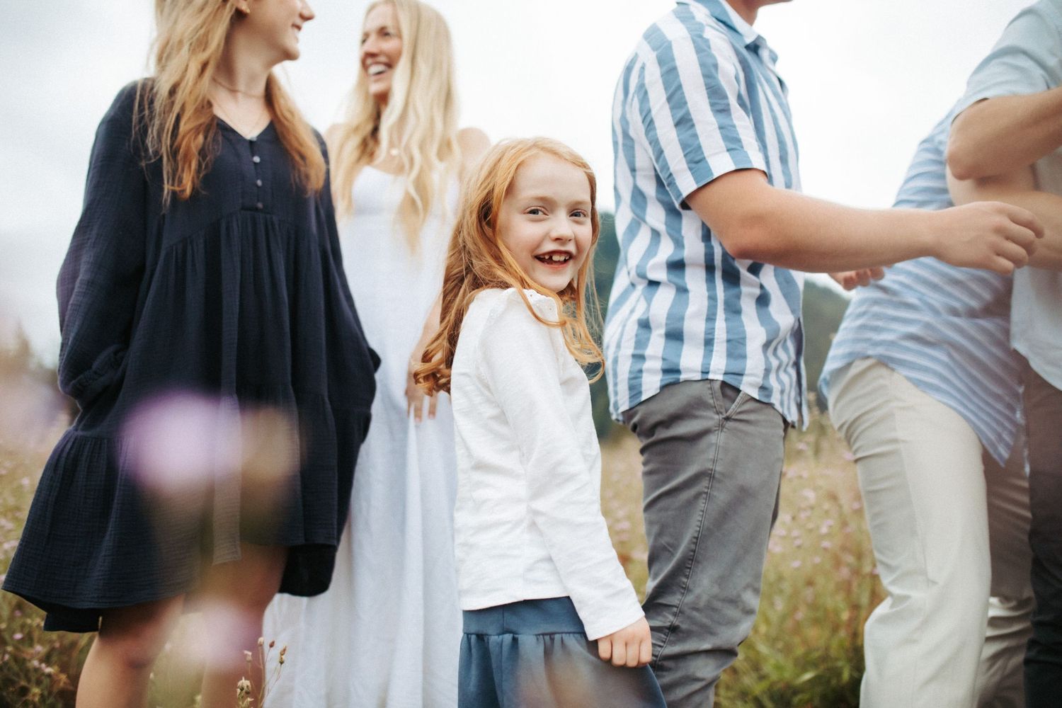 Candid image of a youngest sibling laughing