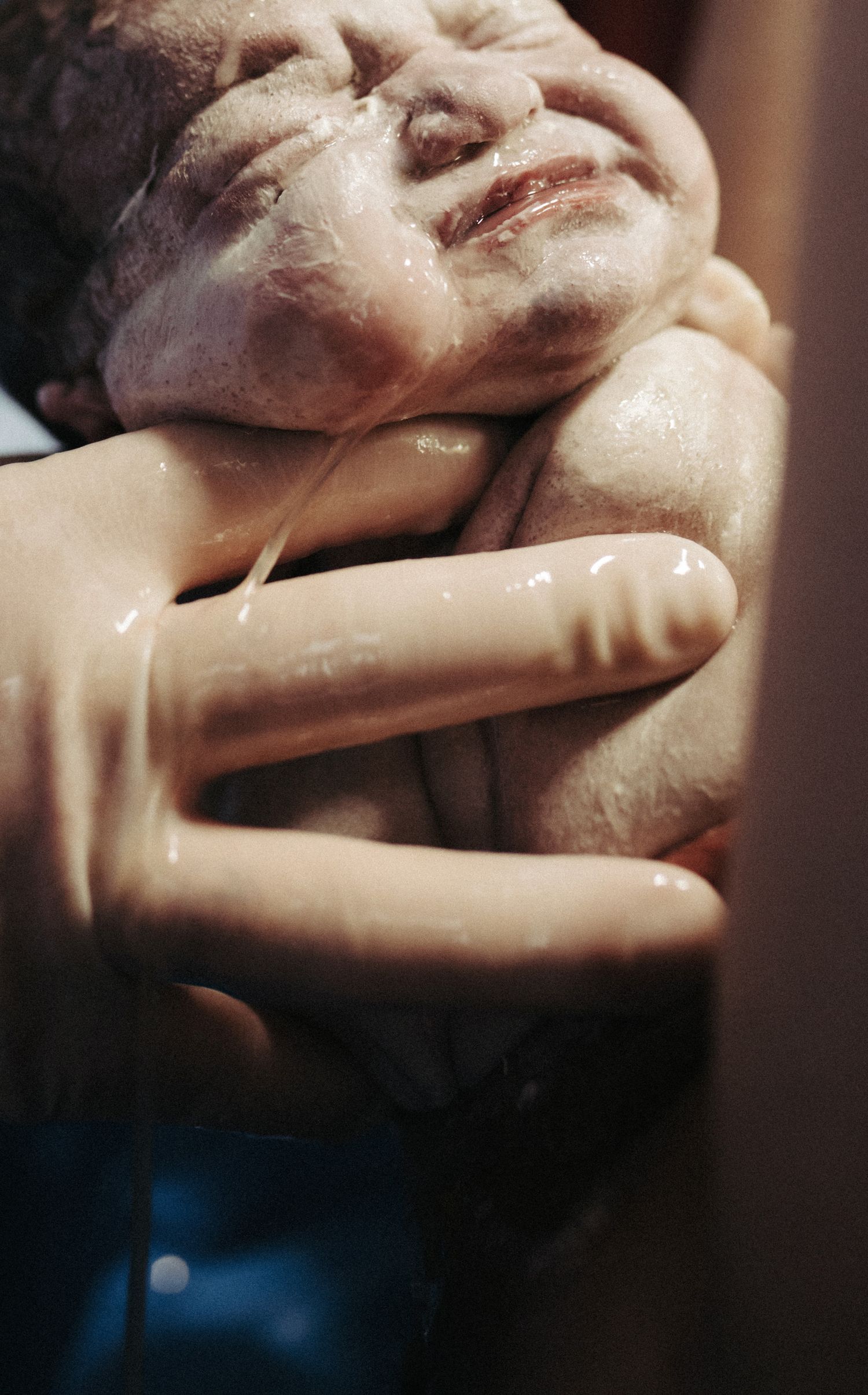 Birth photography of a mom holding her newborn in Boise