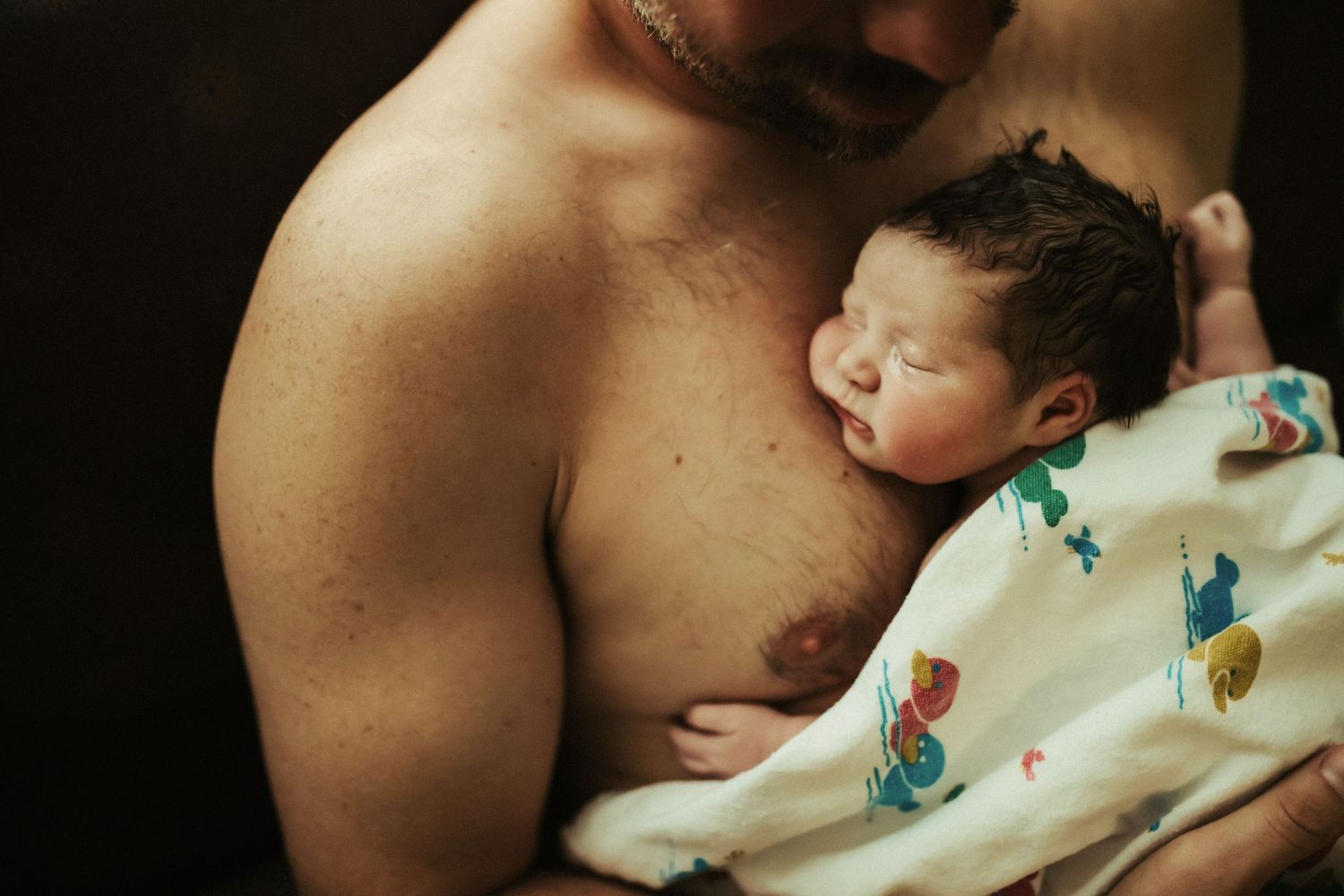 Birth photography of a mom holding her newborn in Boise