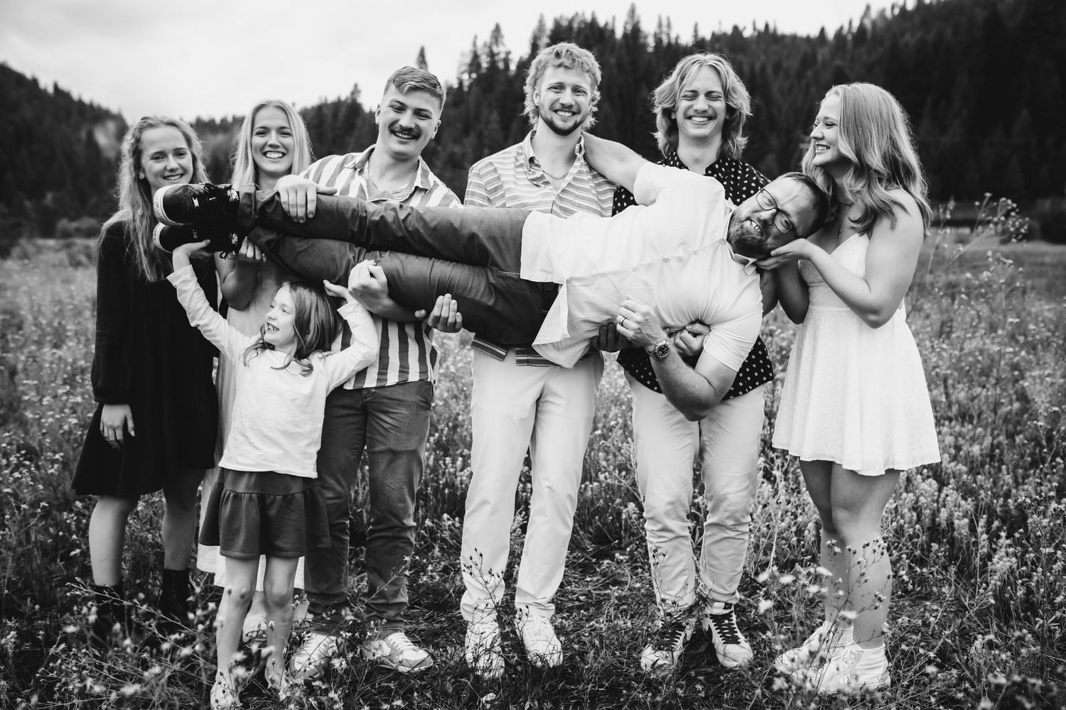 Dad and kids playing together for family photos