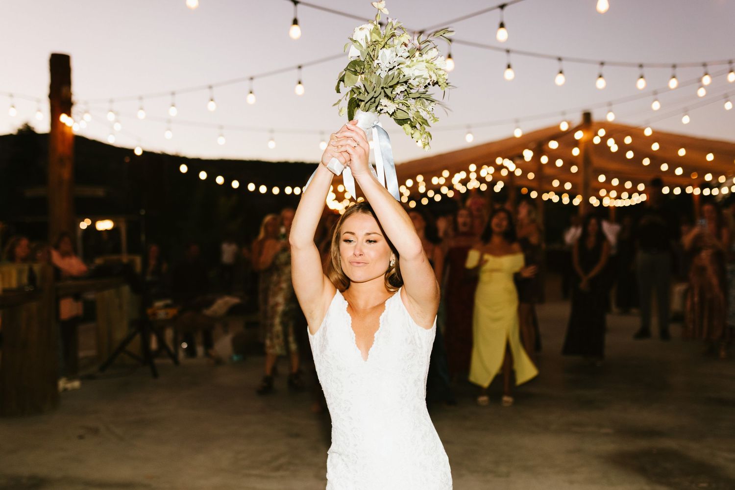 Bride about to toss bouquet