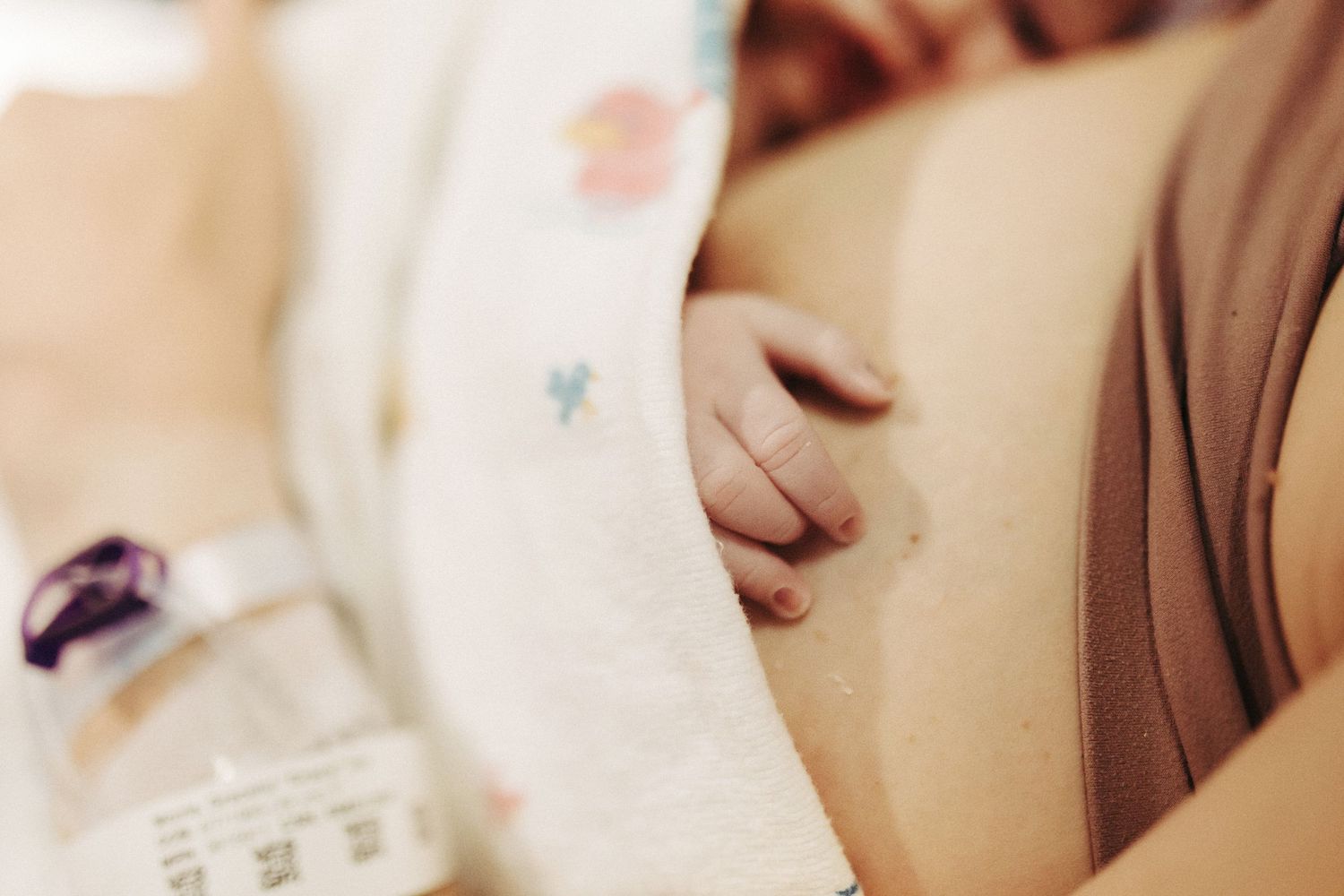 Birth photography of a mom holding her newborn in Boise