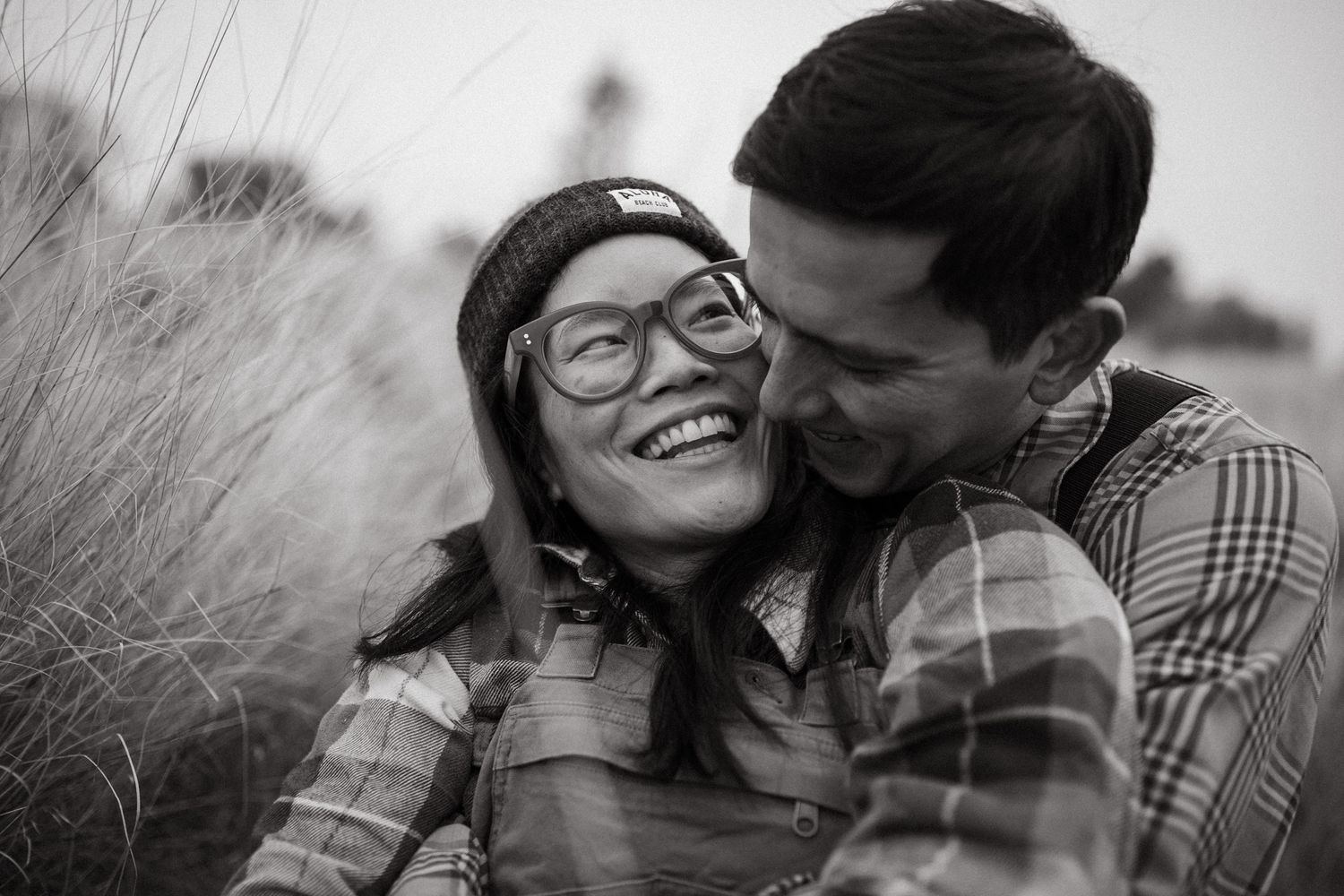 Couple sitting together closely for a photoshoot in Redmond Oregon