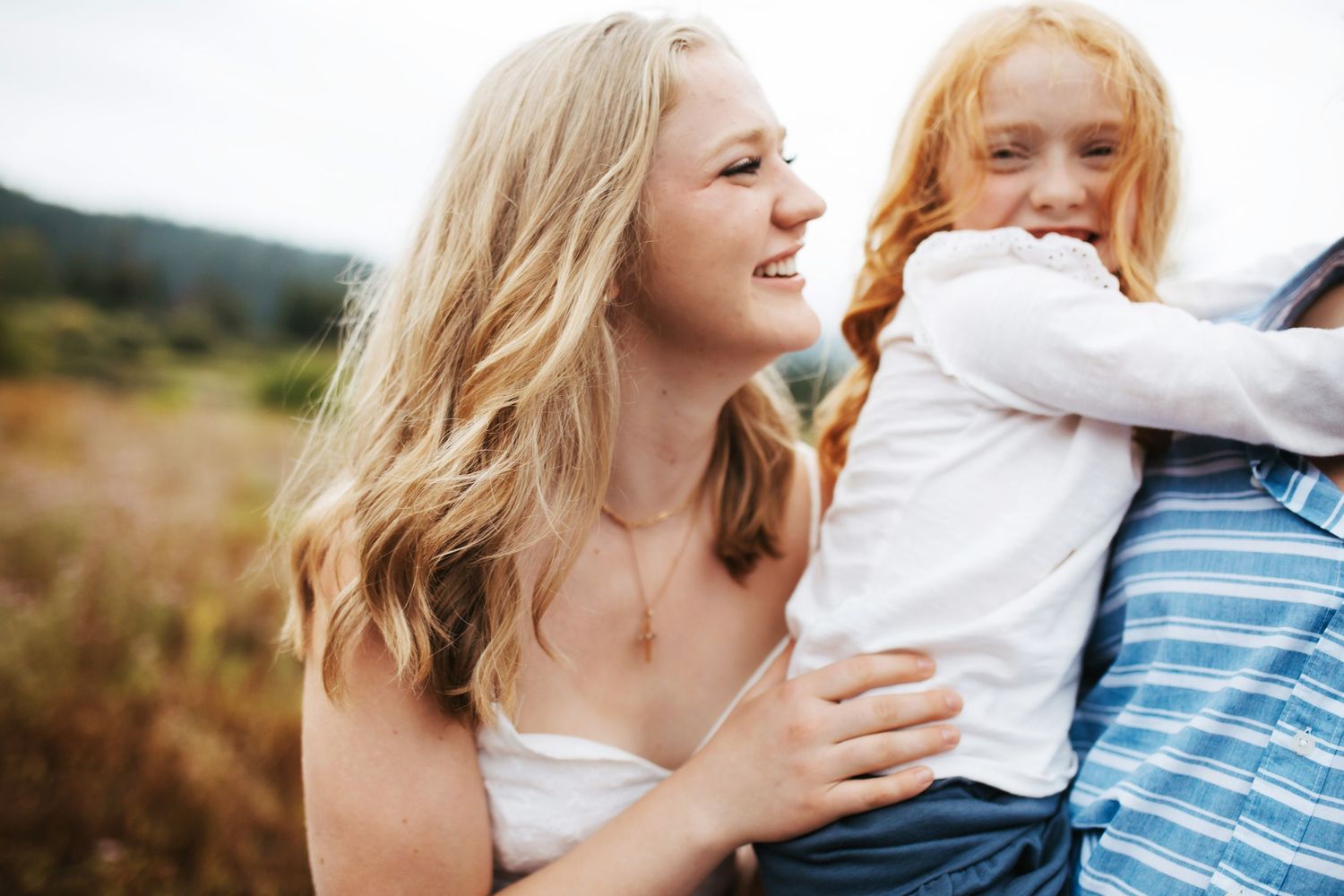 candid image of siblings laughing together