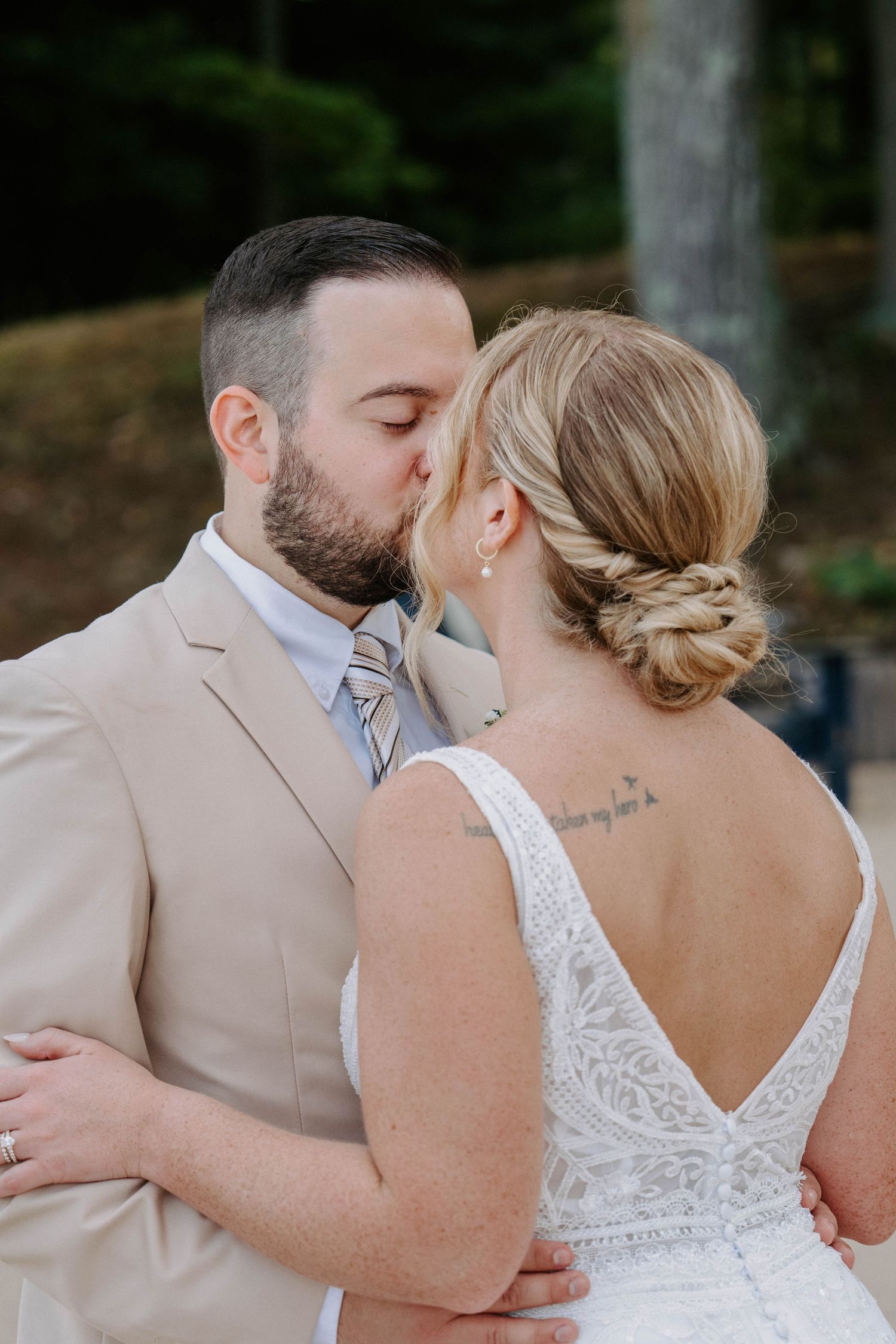 Close-up shots of couple in wedding attire sharing intimate moments together.