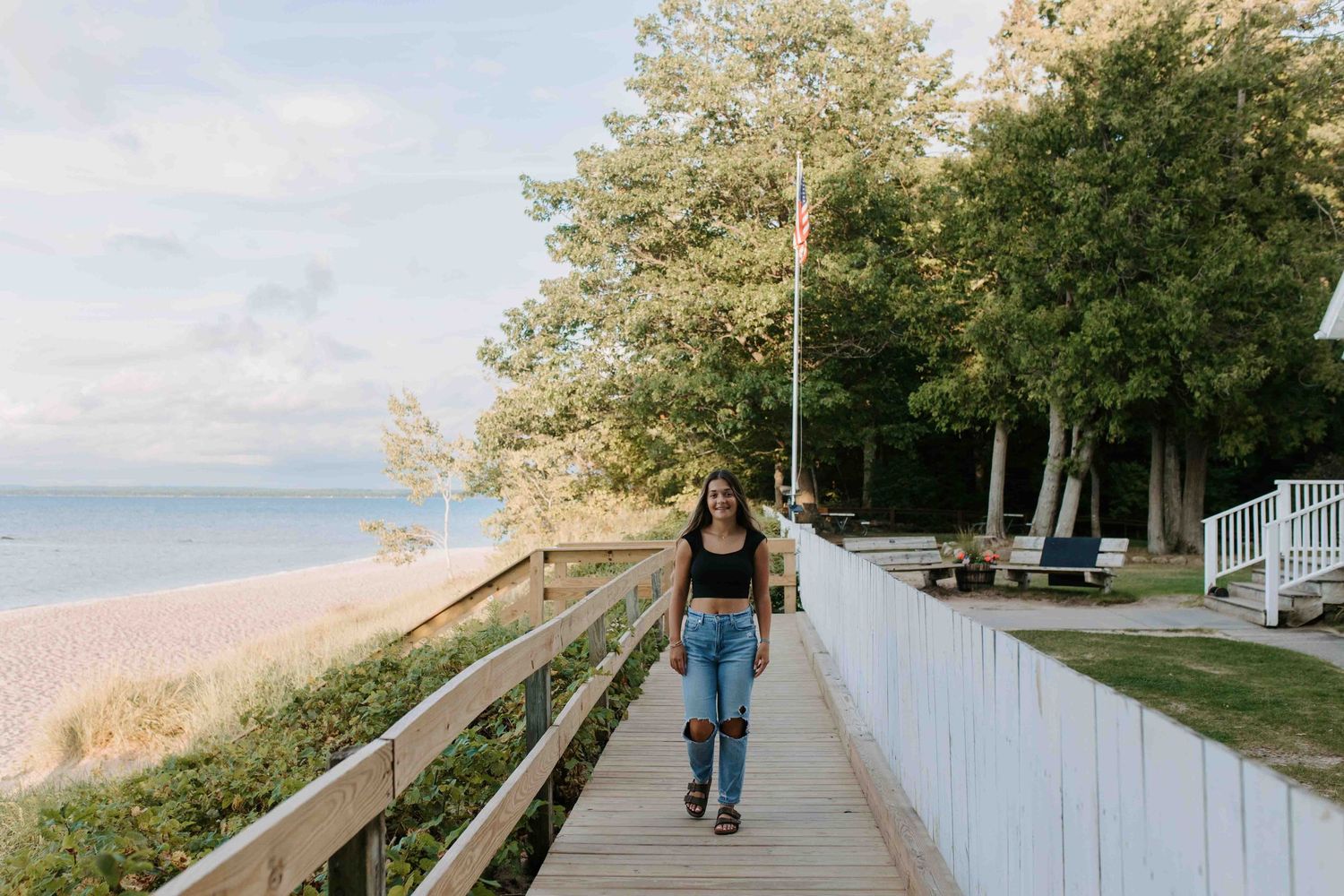 Scenic walkway shots near a coastal lighthouse with natural lighting.