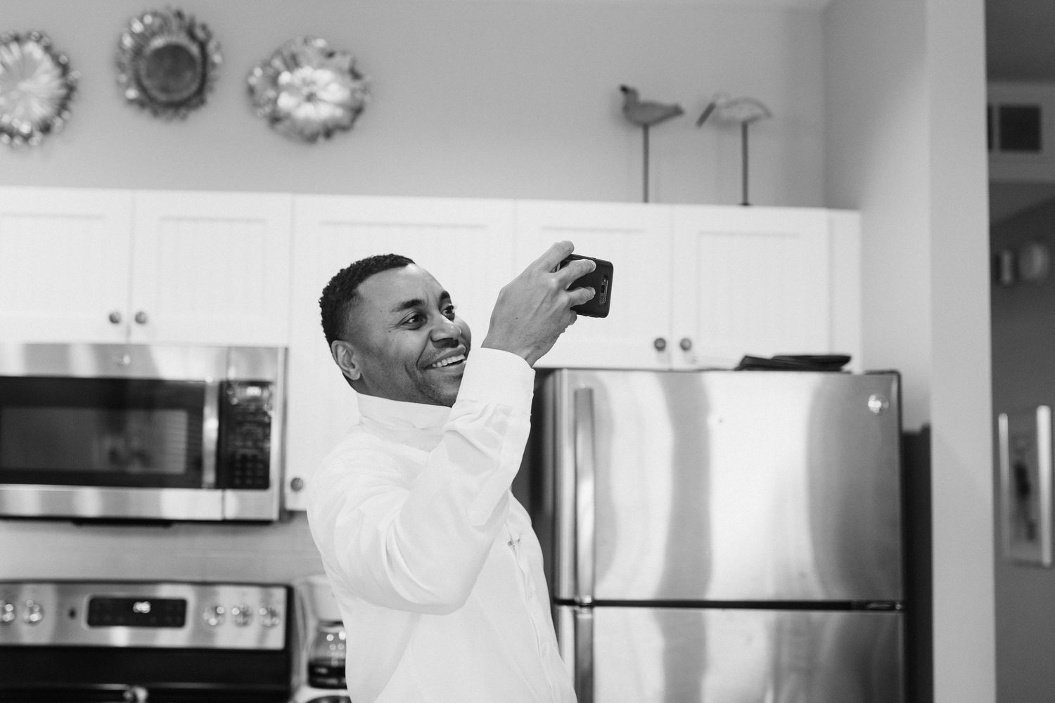 Wedding party preparations in a bright modern kitchen setting.