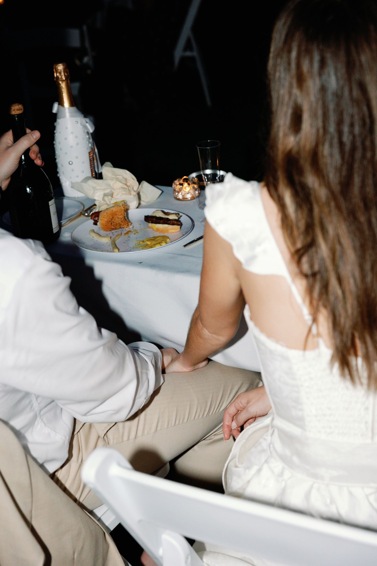 Close-up shots of wedding reception table settings and guests enjoying the celebration.