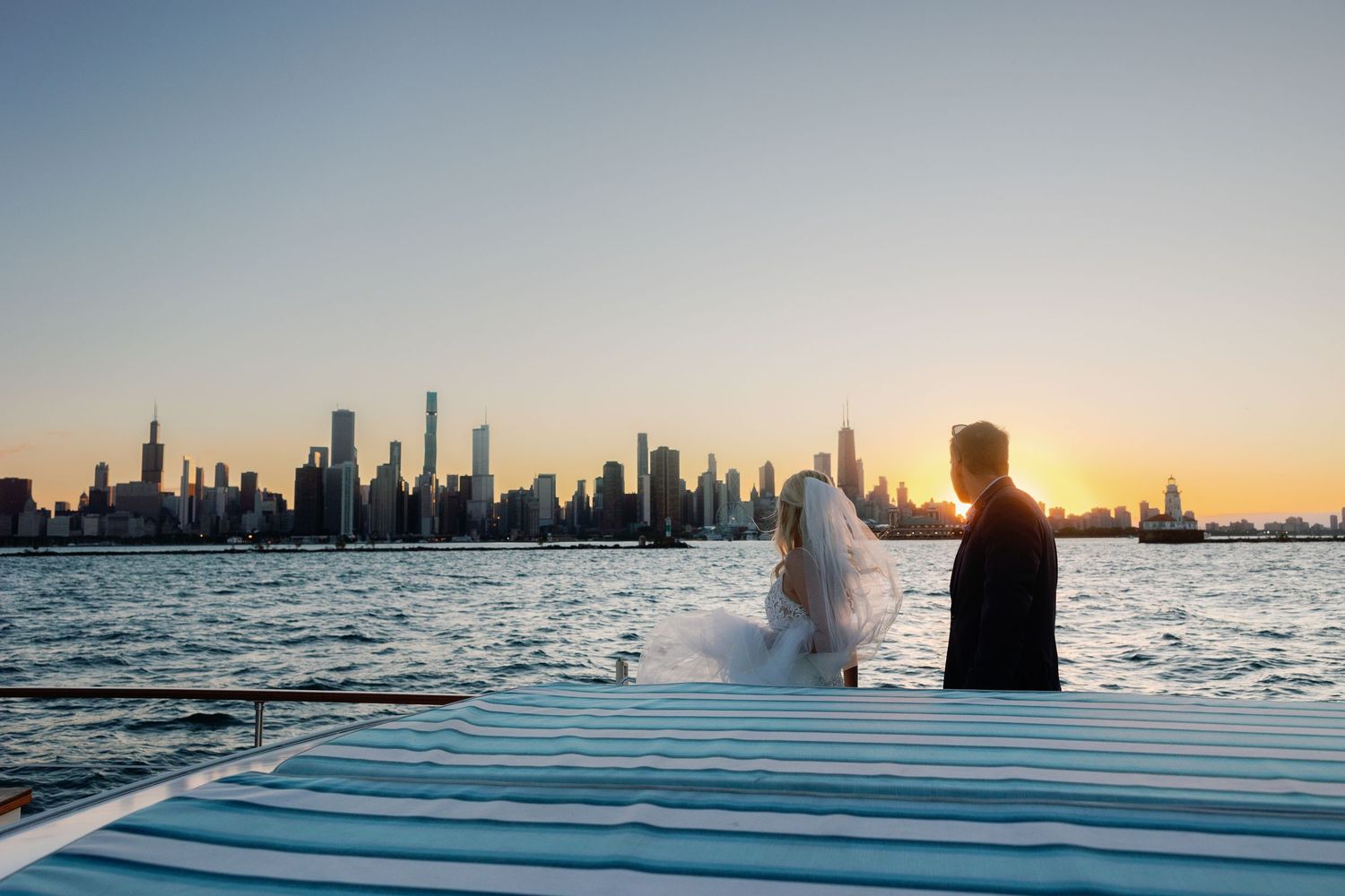 Panoramic views of Chicago skyline at sunset from a boat on Lake Michigan.