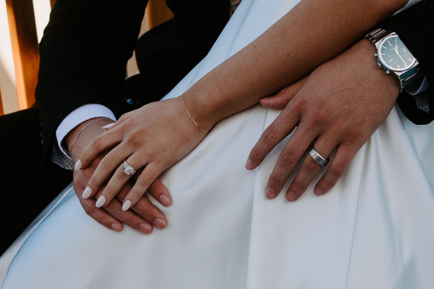 Close-up detail shot of wedding dress and hands during Chicago riverfront photo session.