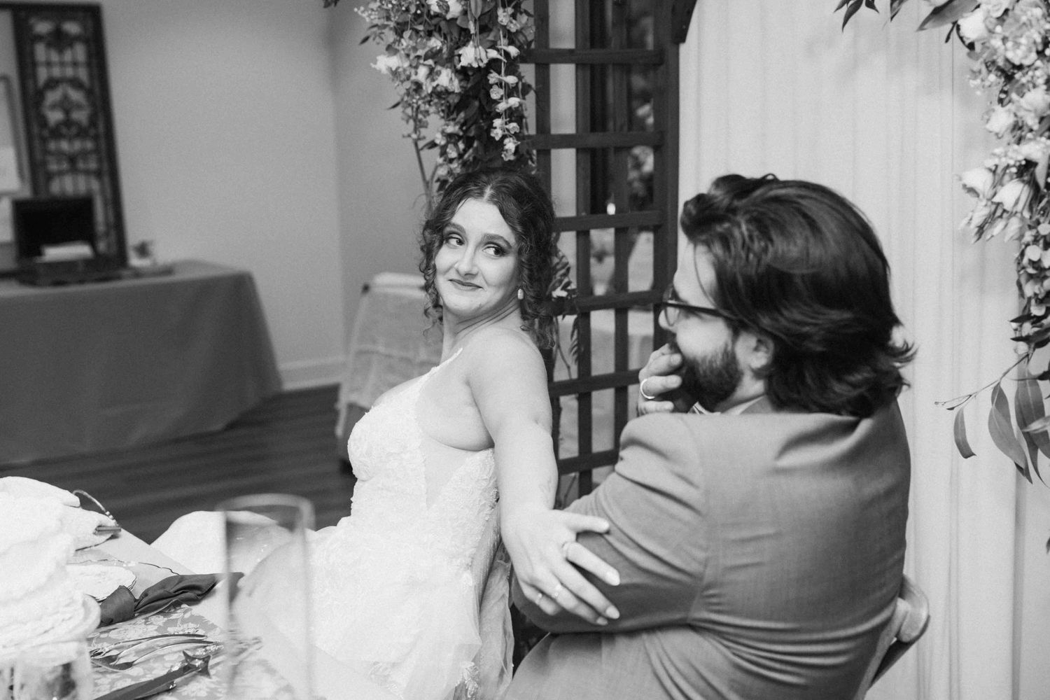 Candid moments captured during an intimate wedding reception celebration.