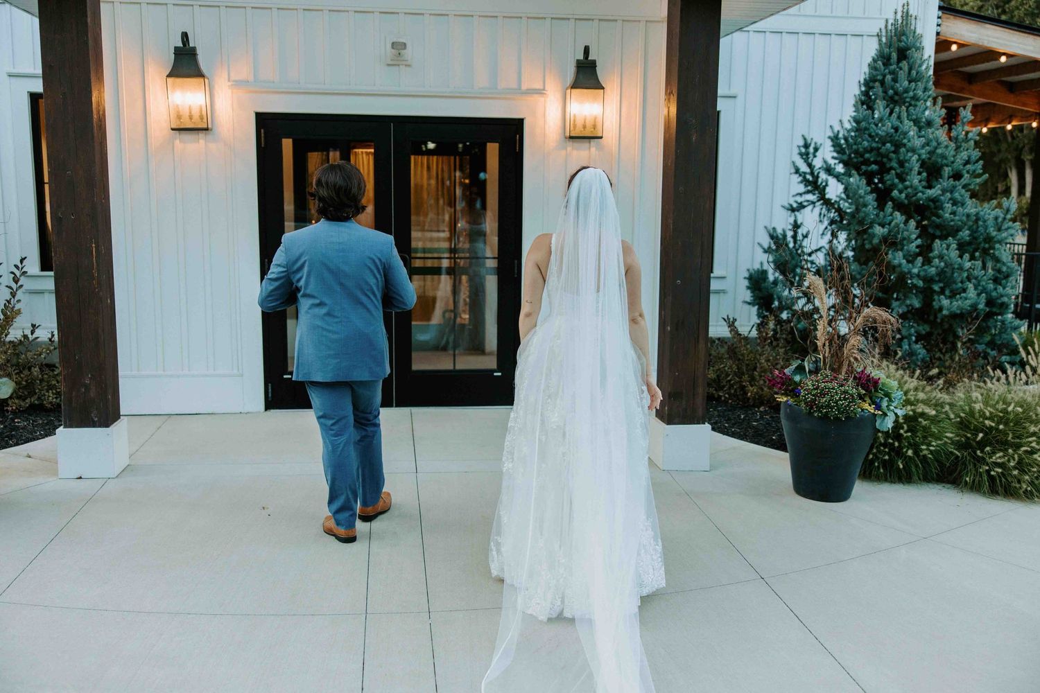 White chapel exterior with elegant arched entrance and decorative details.