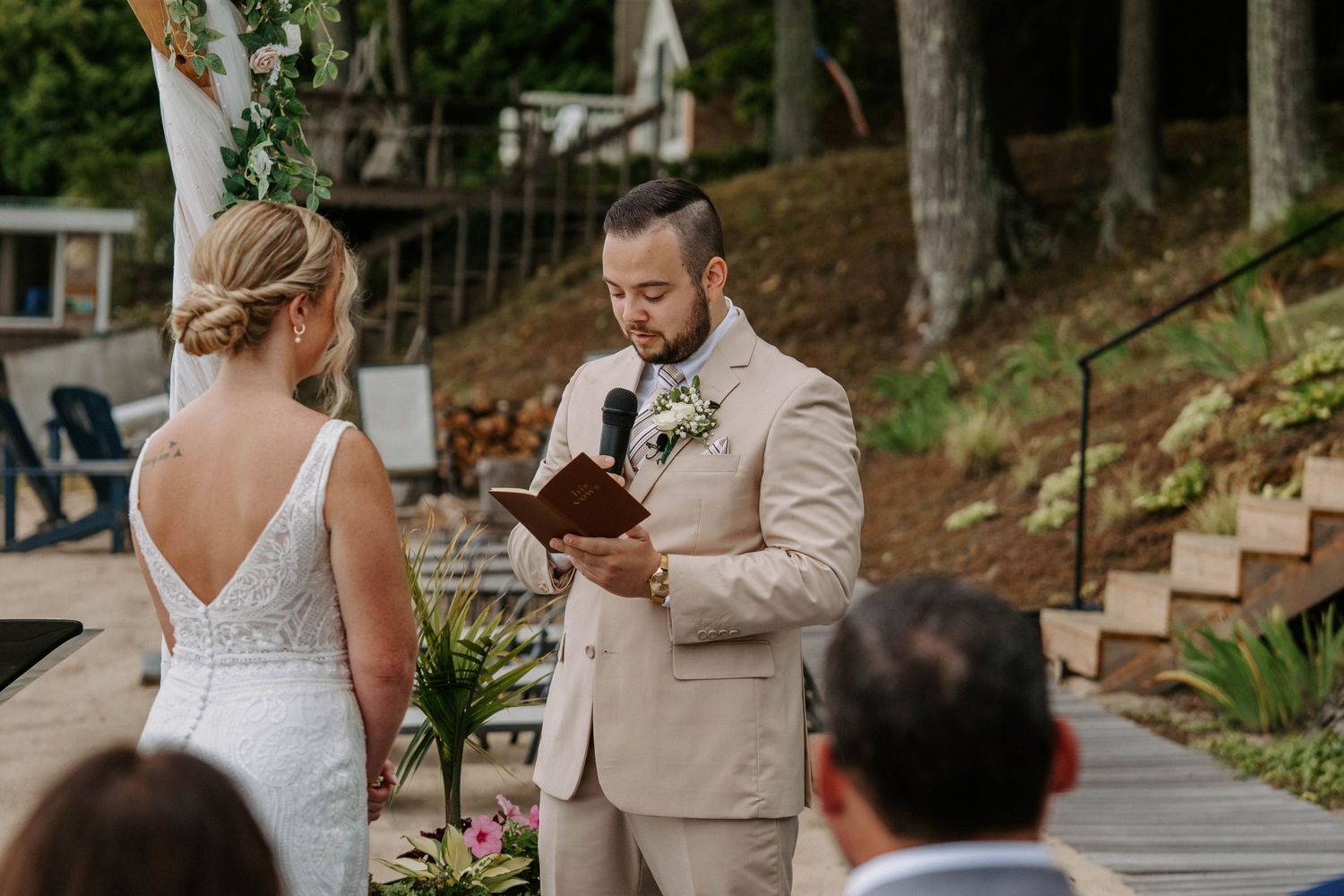 Wedding ceremony moments captured under covered walkway with natural surroundings.