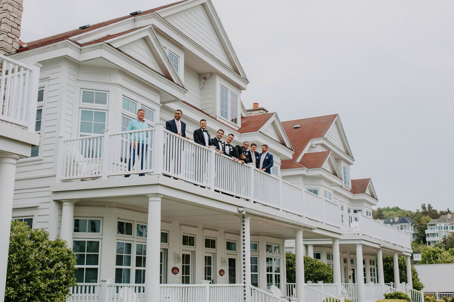 Elegant white coastal wedding venue with classic architecture and ocean views.
