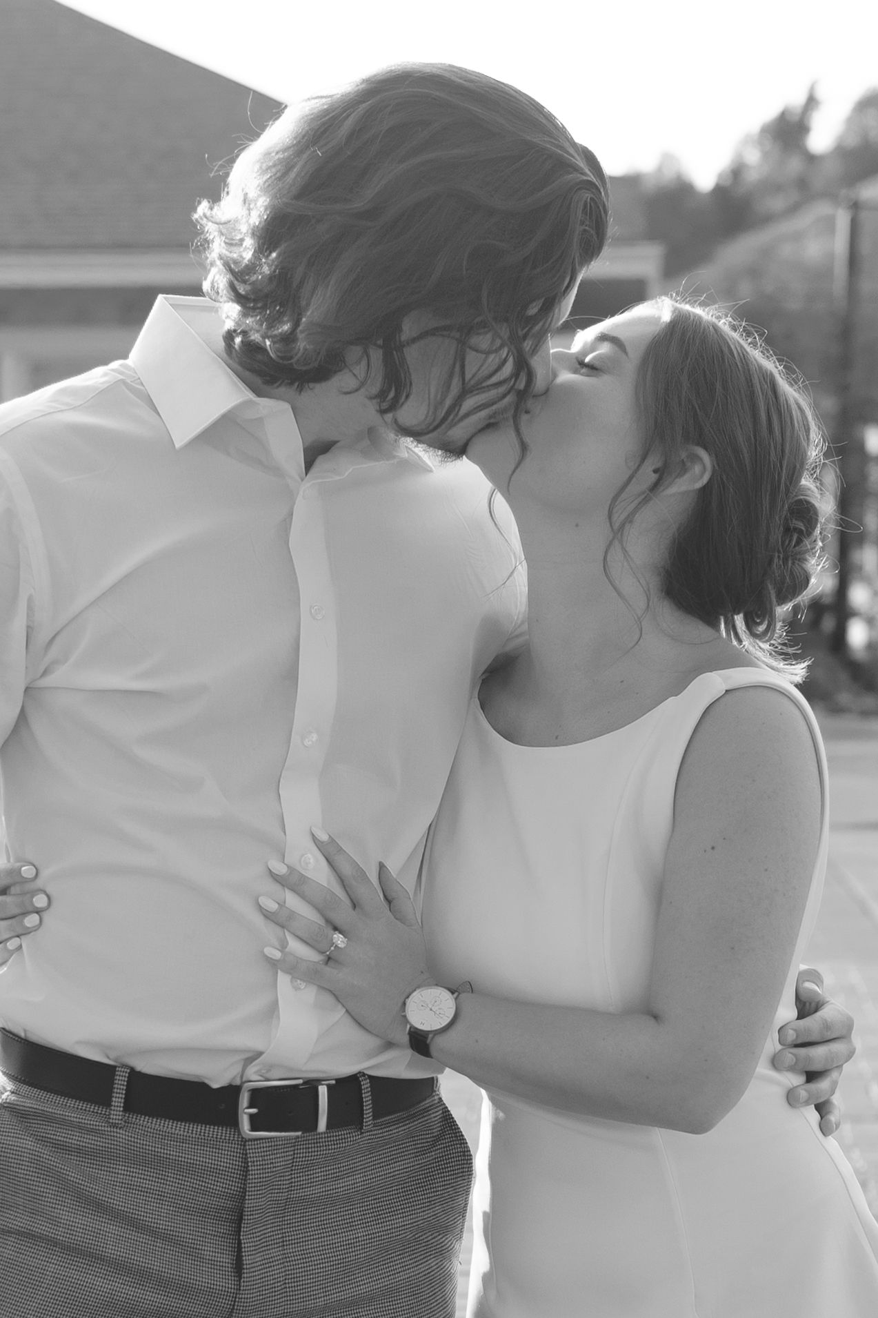 Black and white photo series showing an intimate embrace between two people.