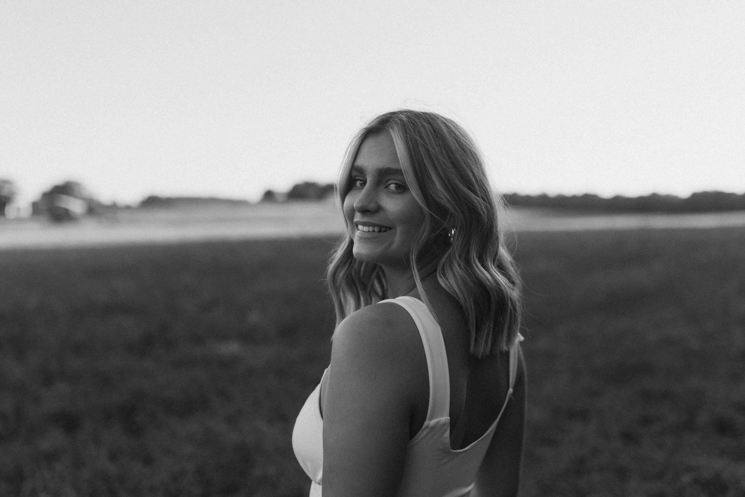 Black and white portrait series captured in natural outdoor lighting.