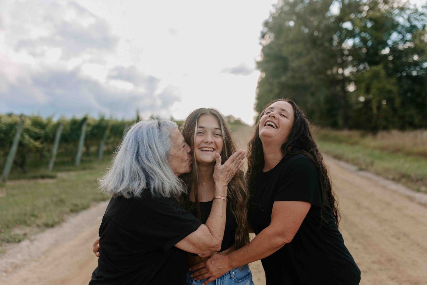Candid moments of happiness captured between two people on a rural path.