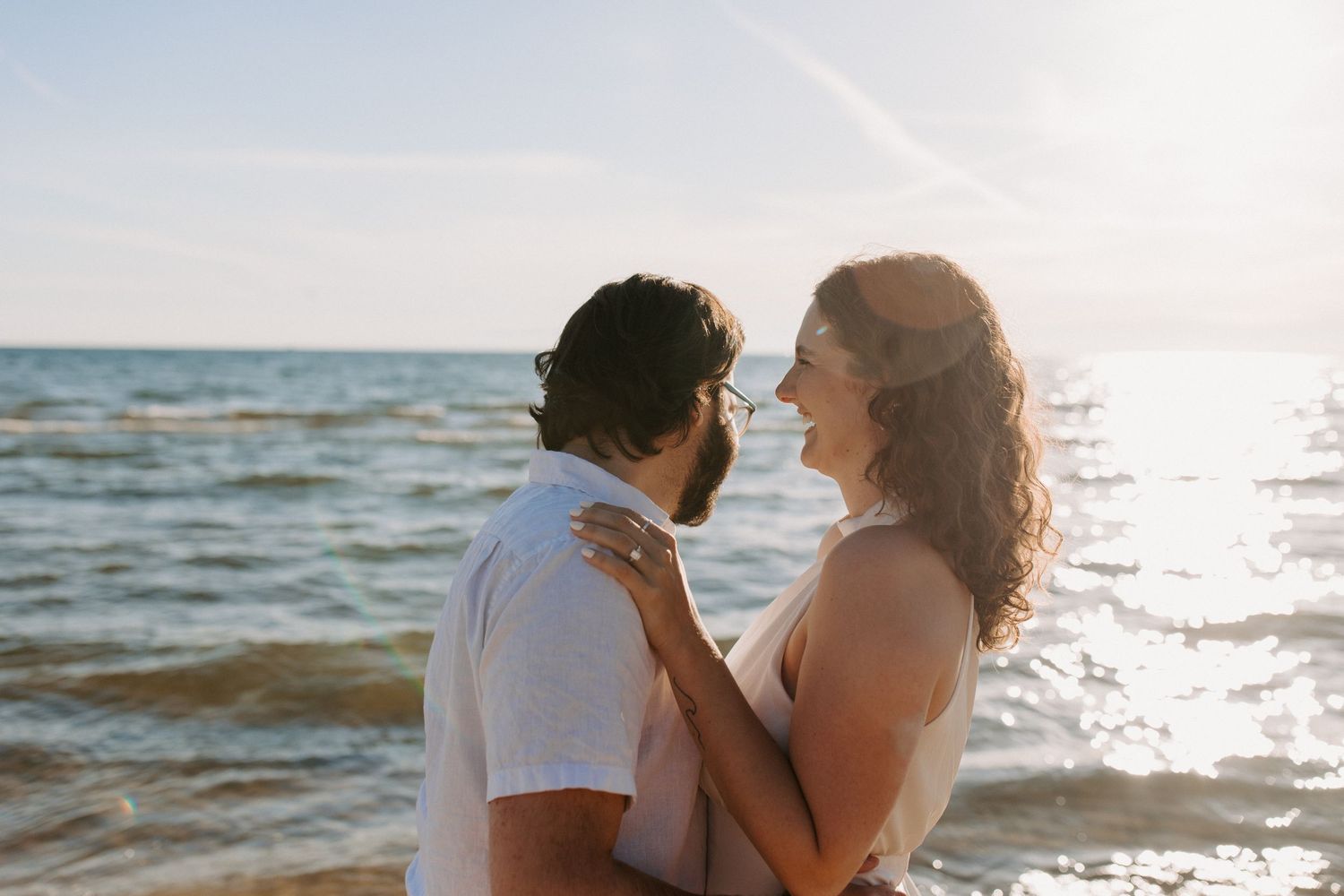 Romantic beach photoshoot during golden hour.