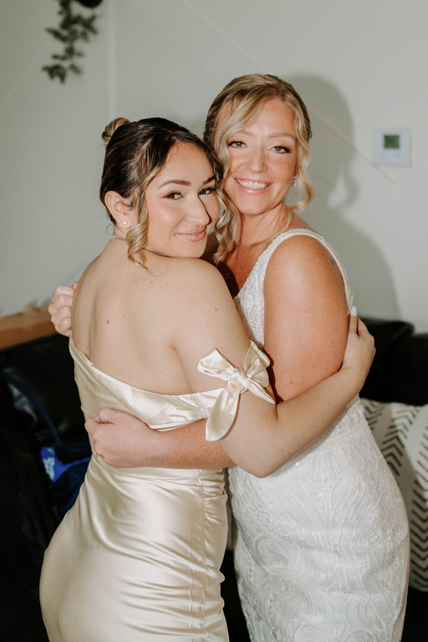 Candid celebratory moment captured during wedding preparations.