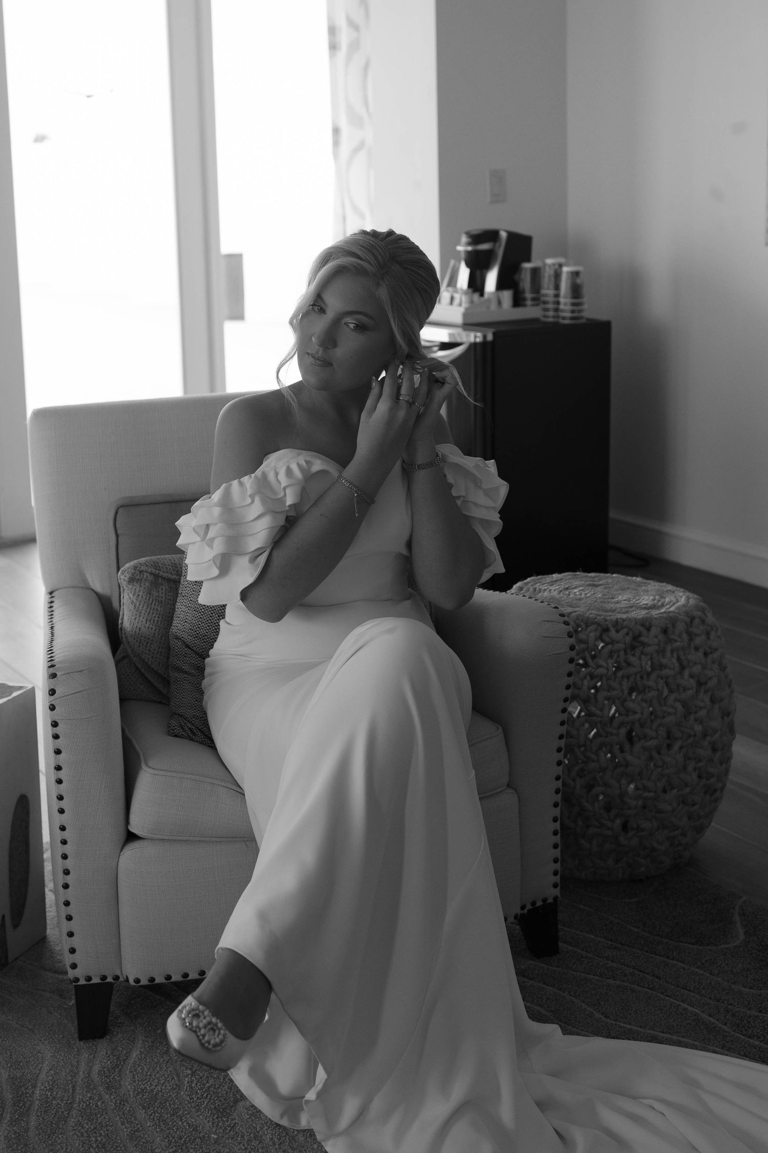 Black and white photo sequence showing emotional moments in an elegant interior setting.