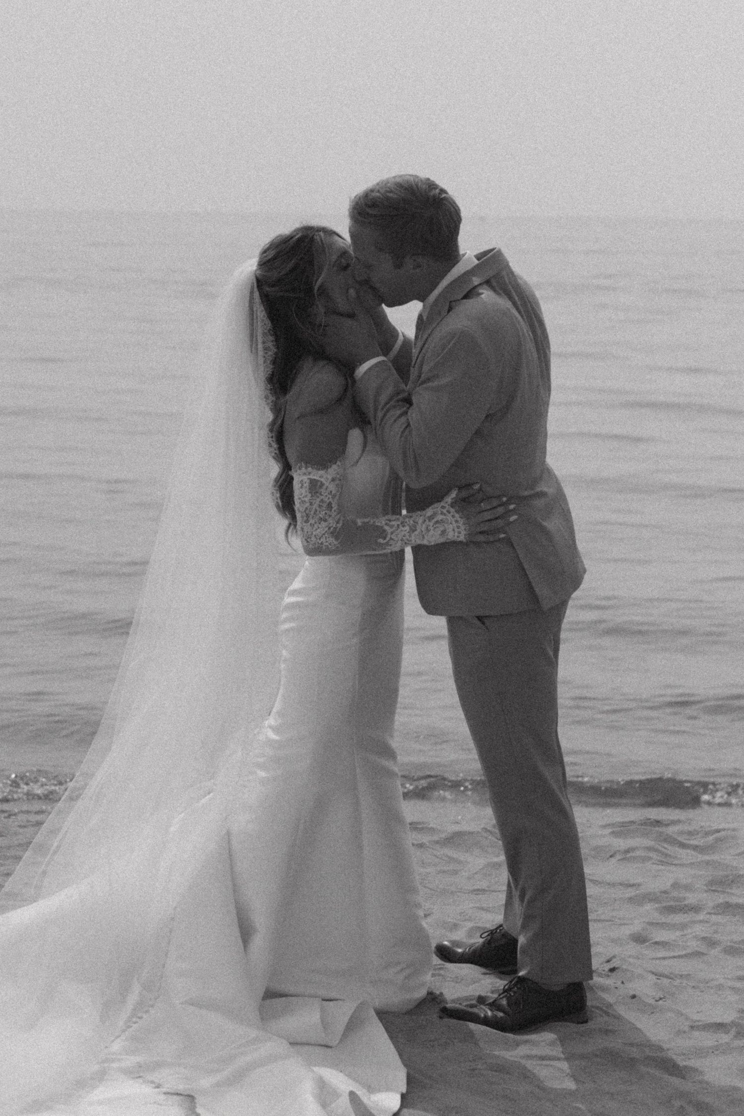 A romantic beach wedding sequence shows a couple embracing by the ocean.