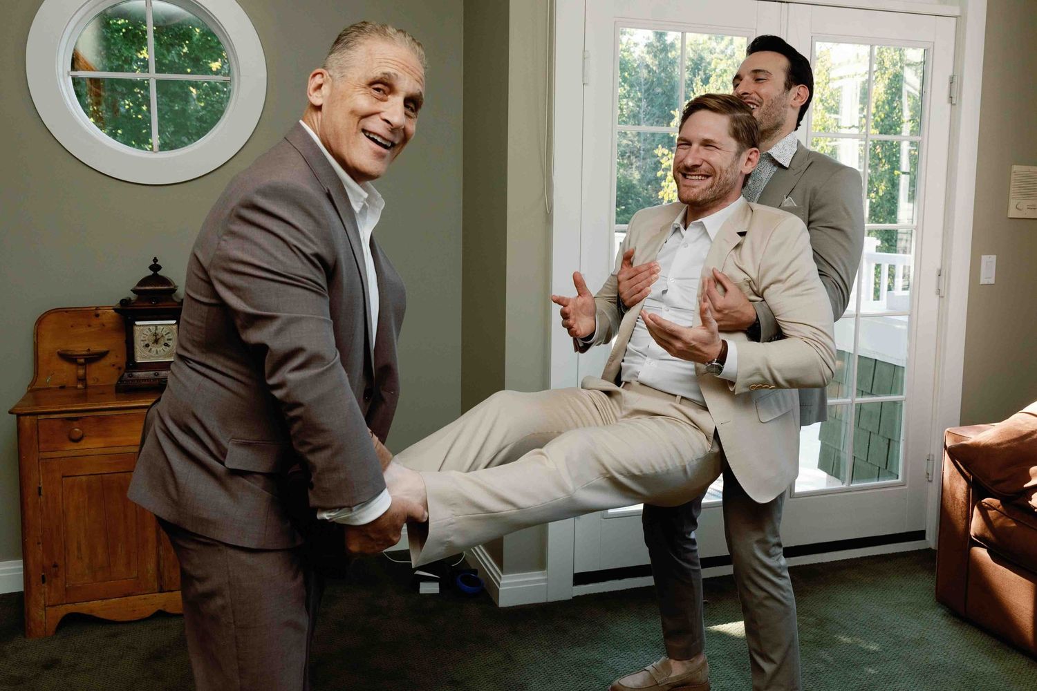 Playful moments captured in a bright indoor space with large windows.