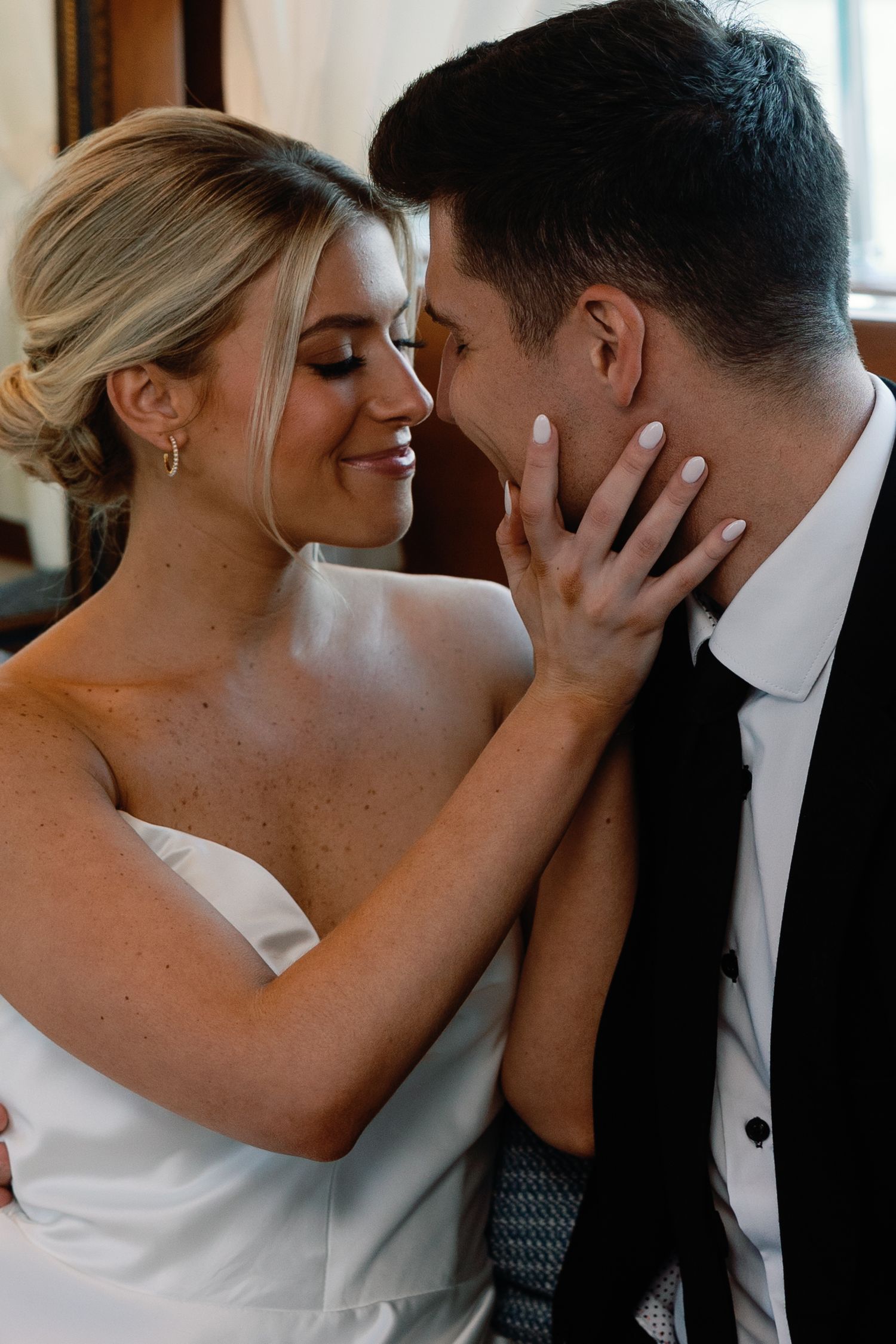 Romantic close-up wedding portraits showing tender moments between newlyweds.