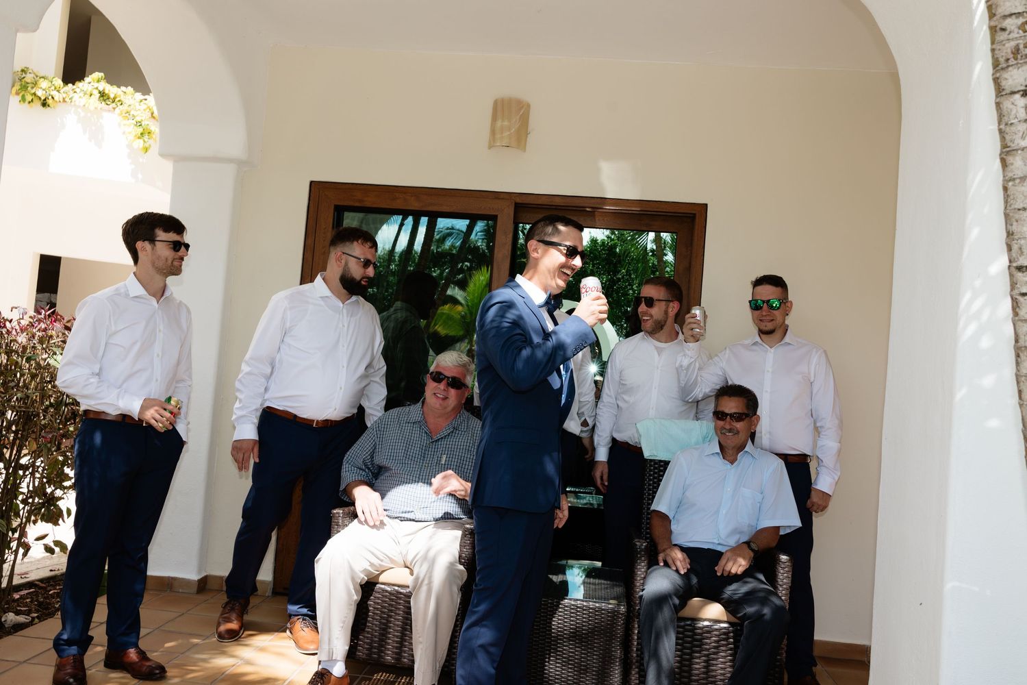 A series of connected photos showing people in formal attire interacting at what appears to be a business or social gathering.
