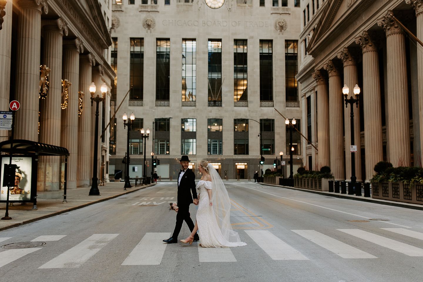 Architectural wedding photos featuring classical columns and urban Chicago streetscape.