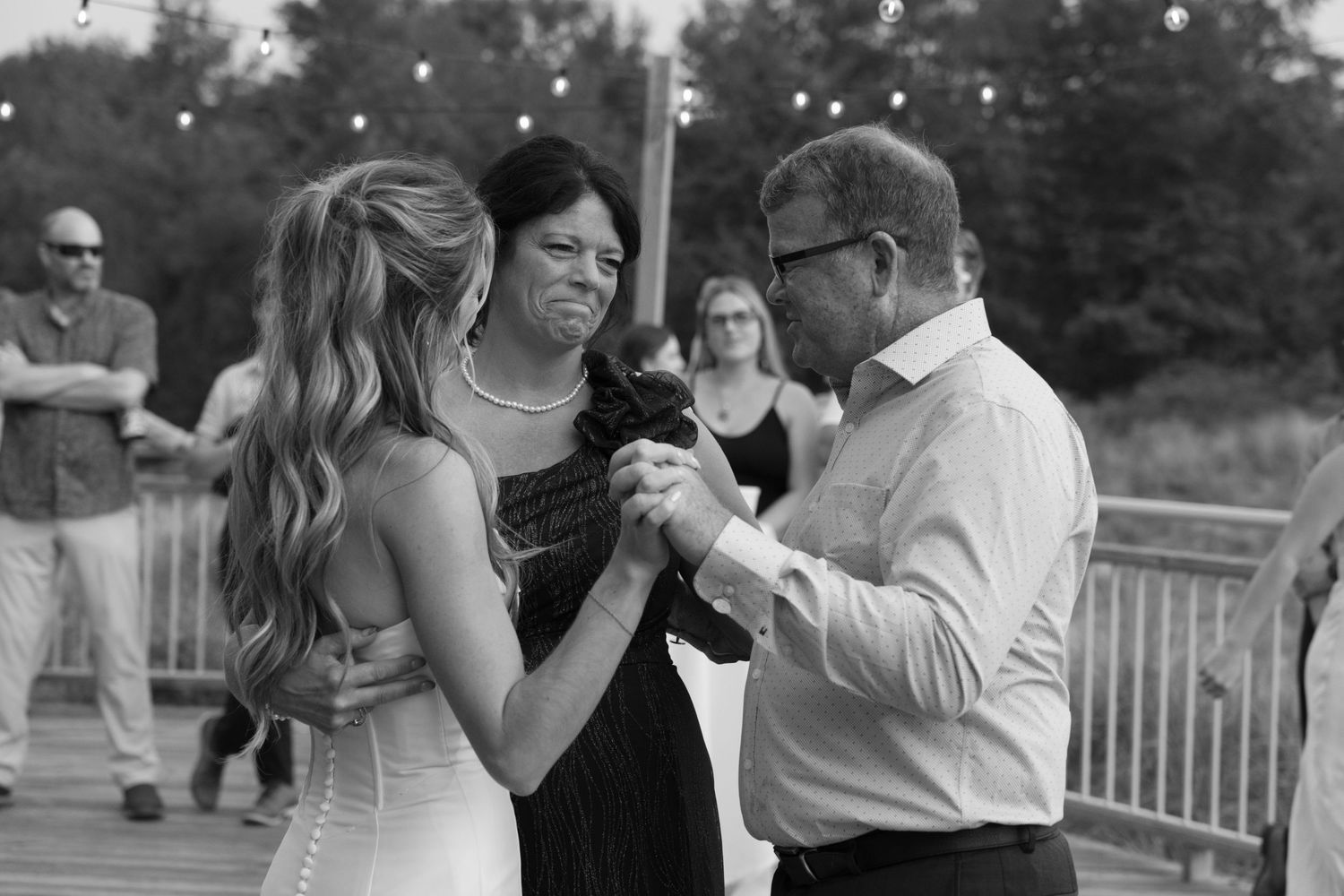 Black and white photo of couples dancing at an elegant evening reception.