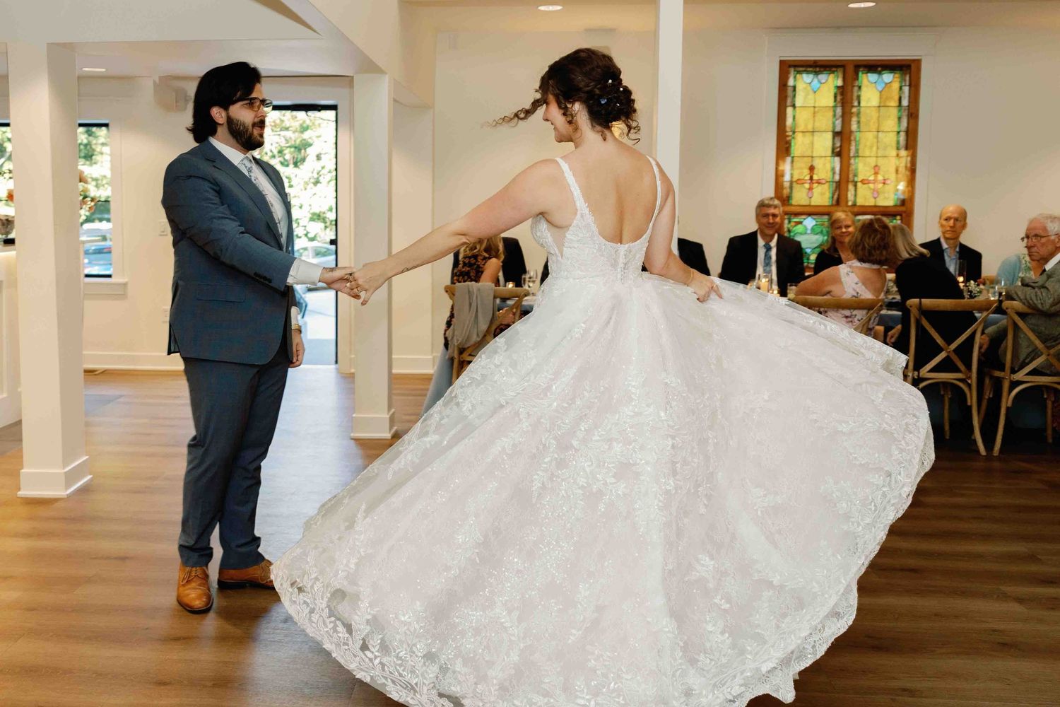 Wedding dance sequence showing a dramatic dip move on the reception dance floor.