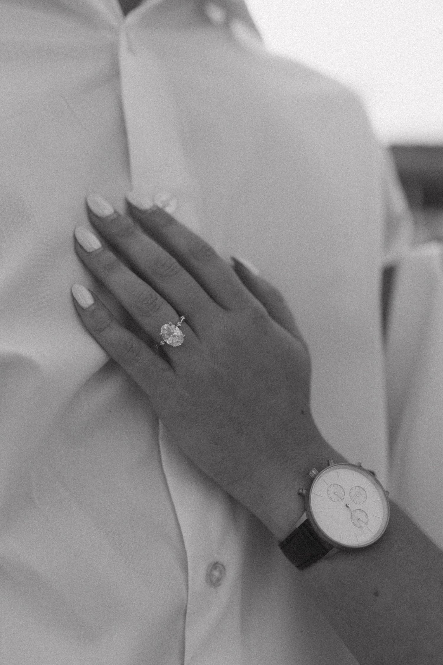 Close-up series of hands displaying an engagement ring.