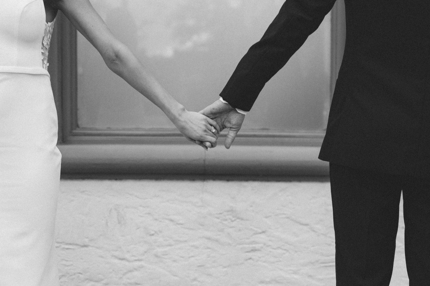 Luxury wedding photography of bride and groom holding hands in Chicago.