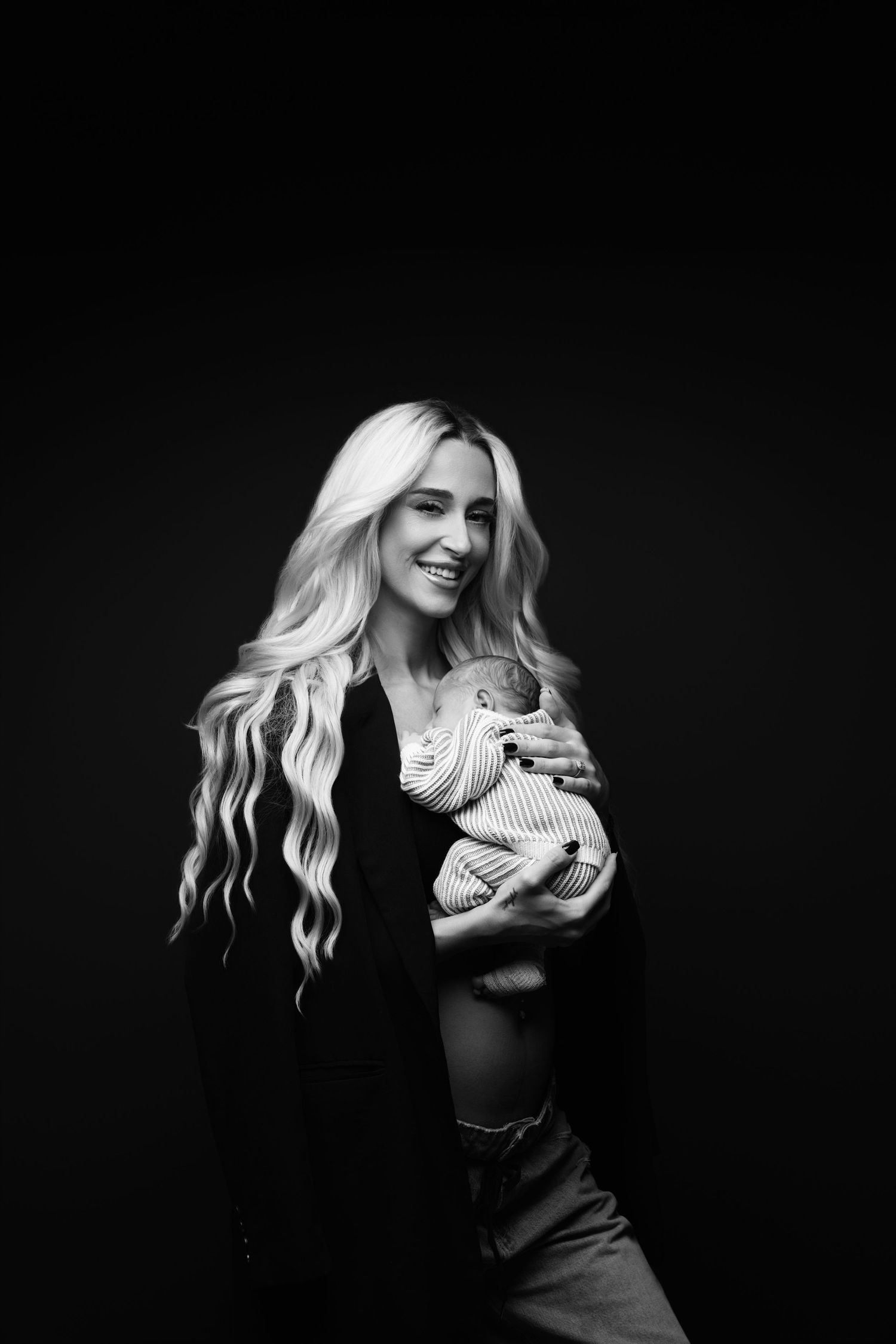 Black and white artistic photo series showing a person with long blonde hair posing against dark background.