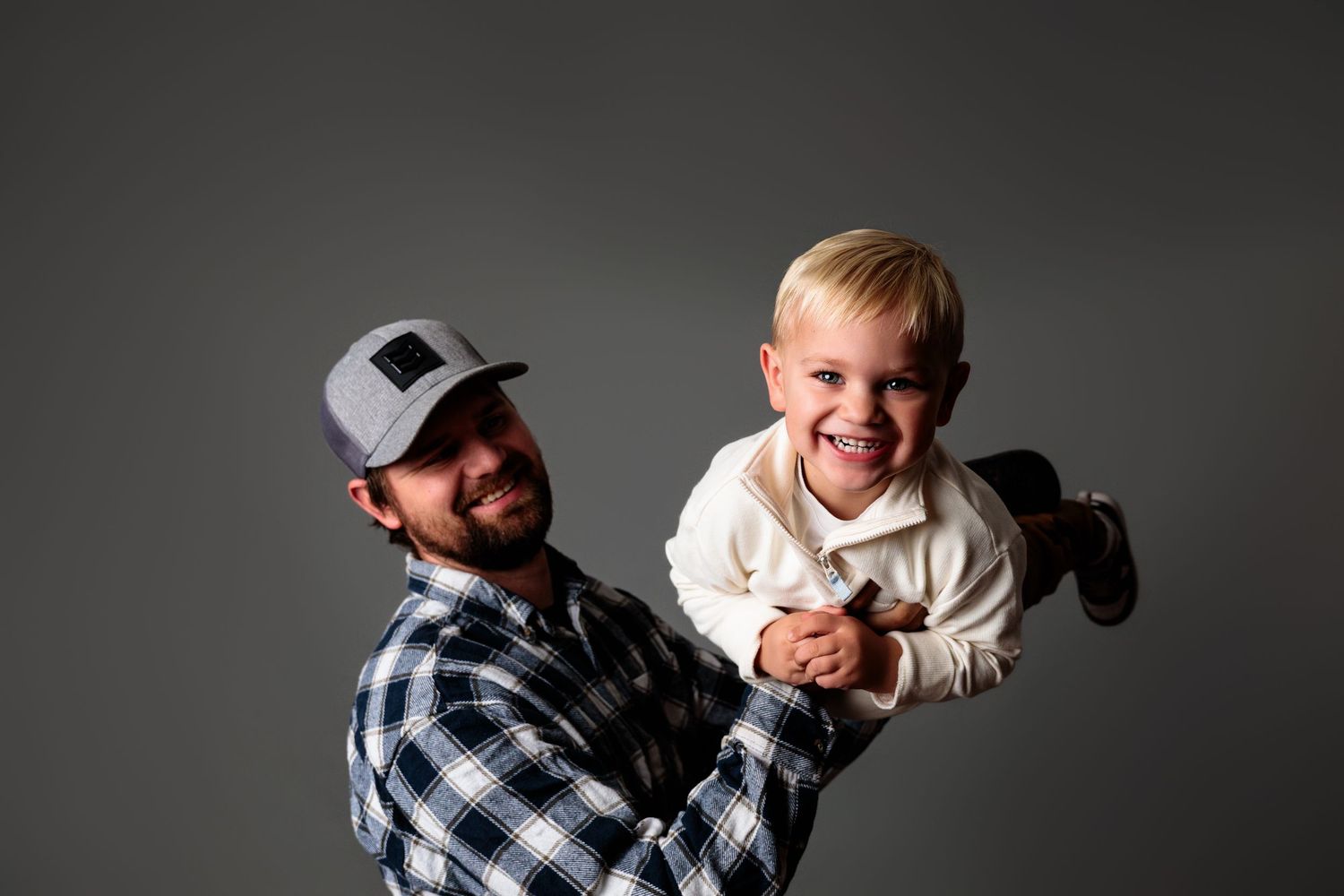Black and white portrait series showing joyful expressions and natural poses.