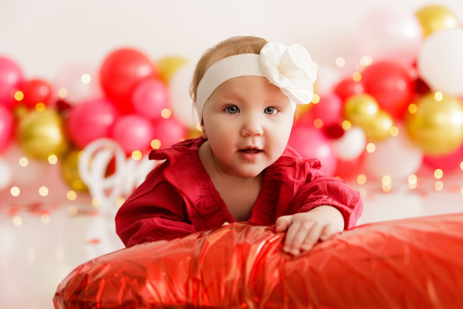 Festive scene with red and gold balloons creating a cheerful holiday backdrop.