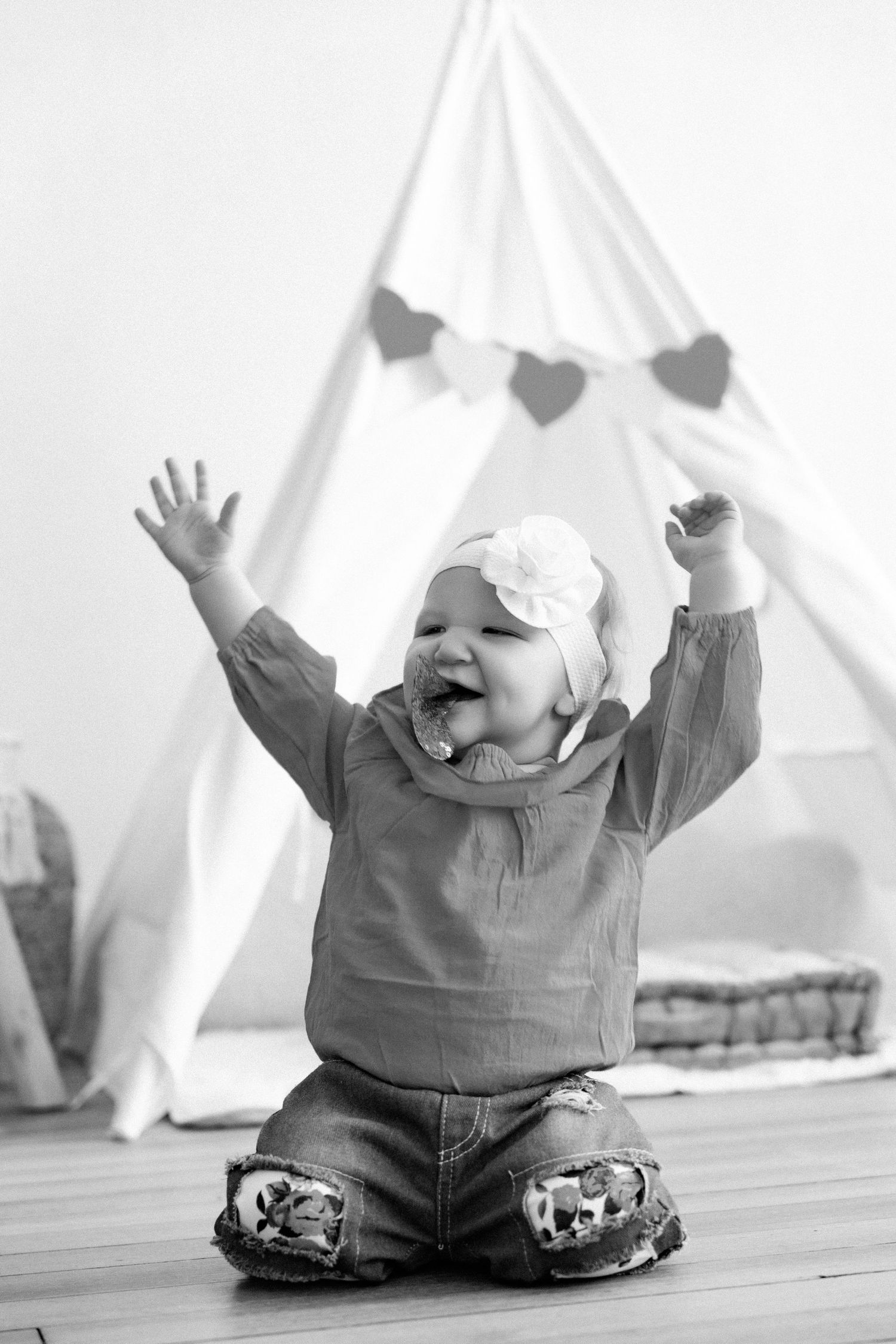 Black and white photo of joyful moment against white background.
