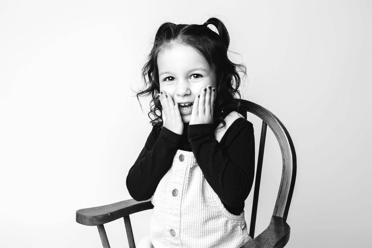 Three black and white portrait photographs showing different expressions and poses.