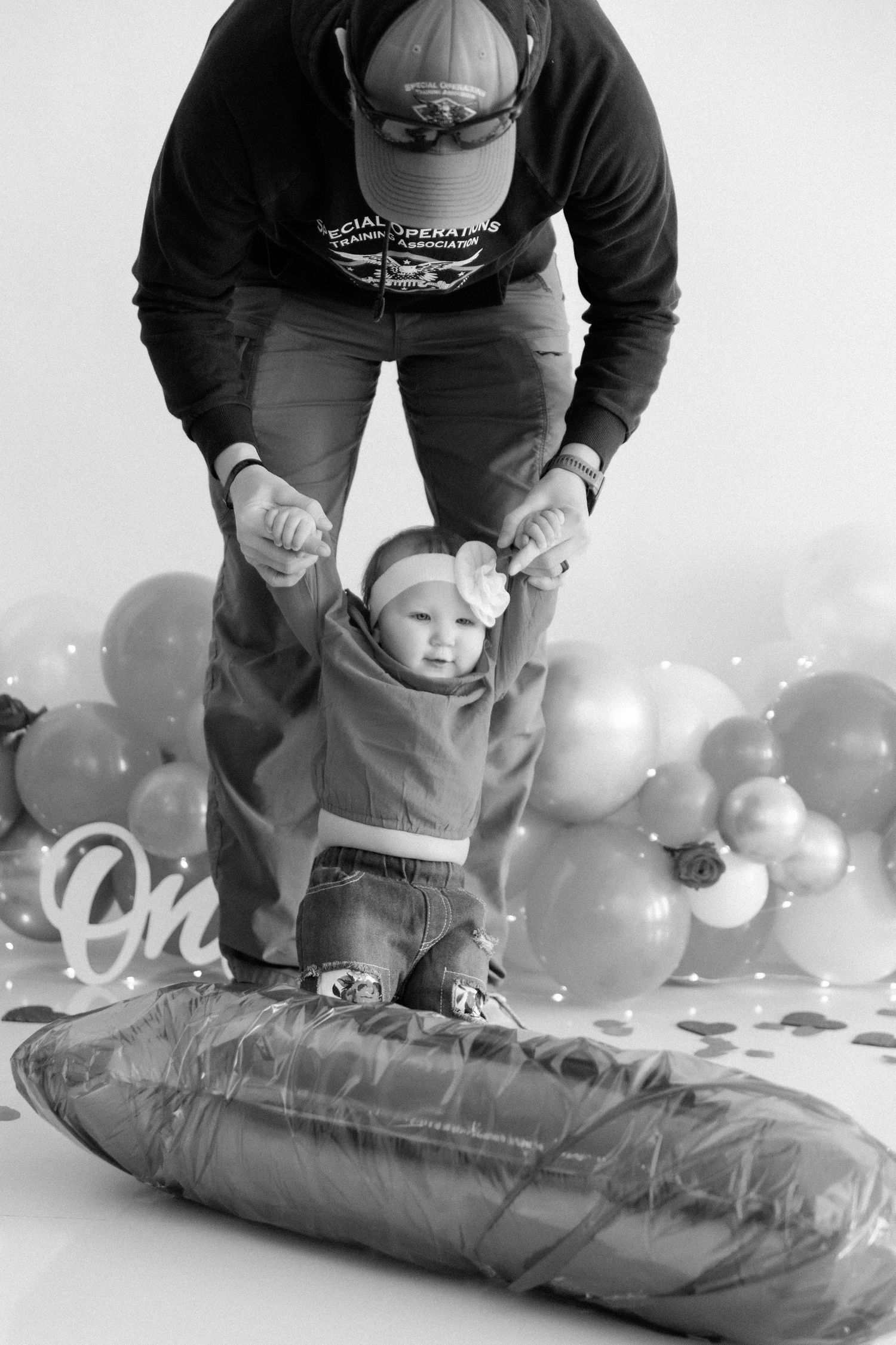 Black and white photo series showing balloon setup and photography preparation.