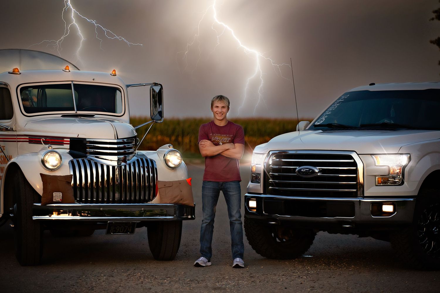 A row of classic pickup trucks and SUVs parked in a line with lightning striking in the stormy background.