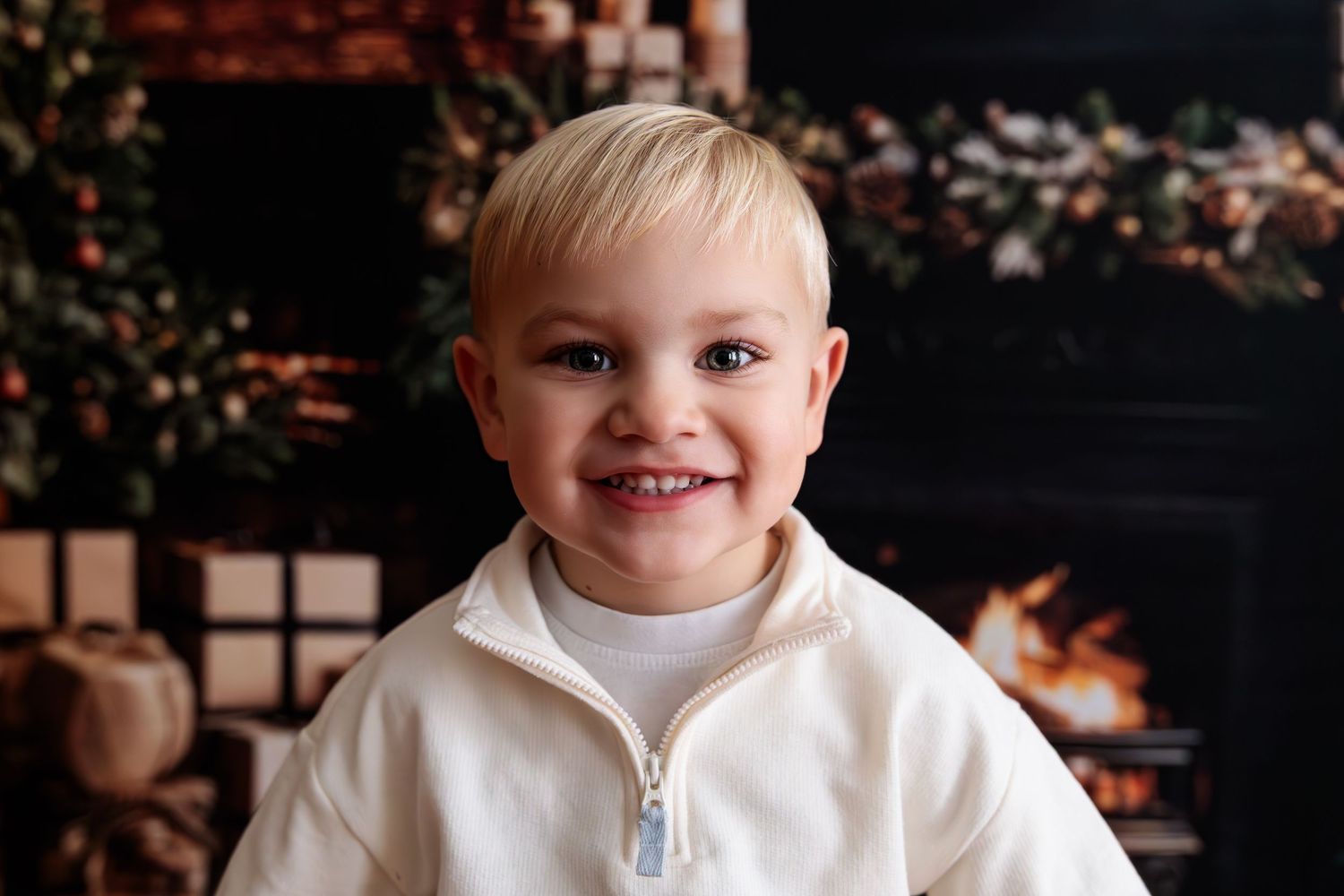 A series of candid shots showing a young child in a white outfit against a dark background.
