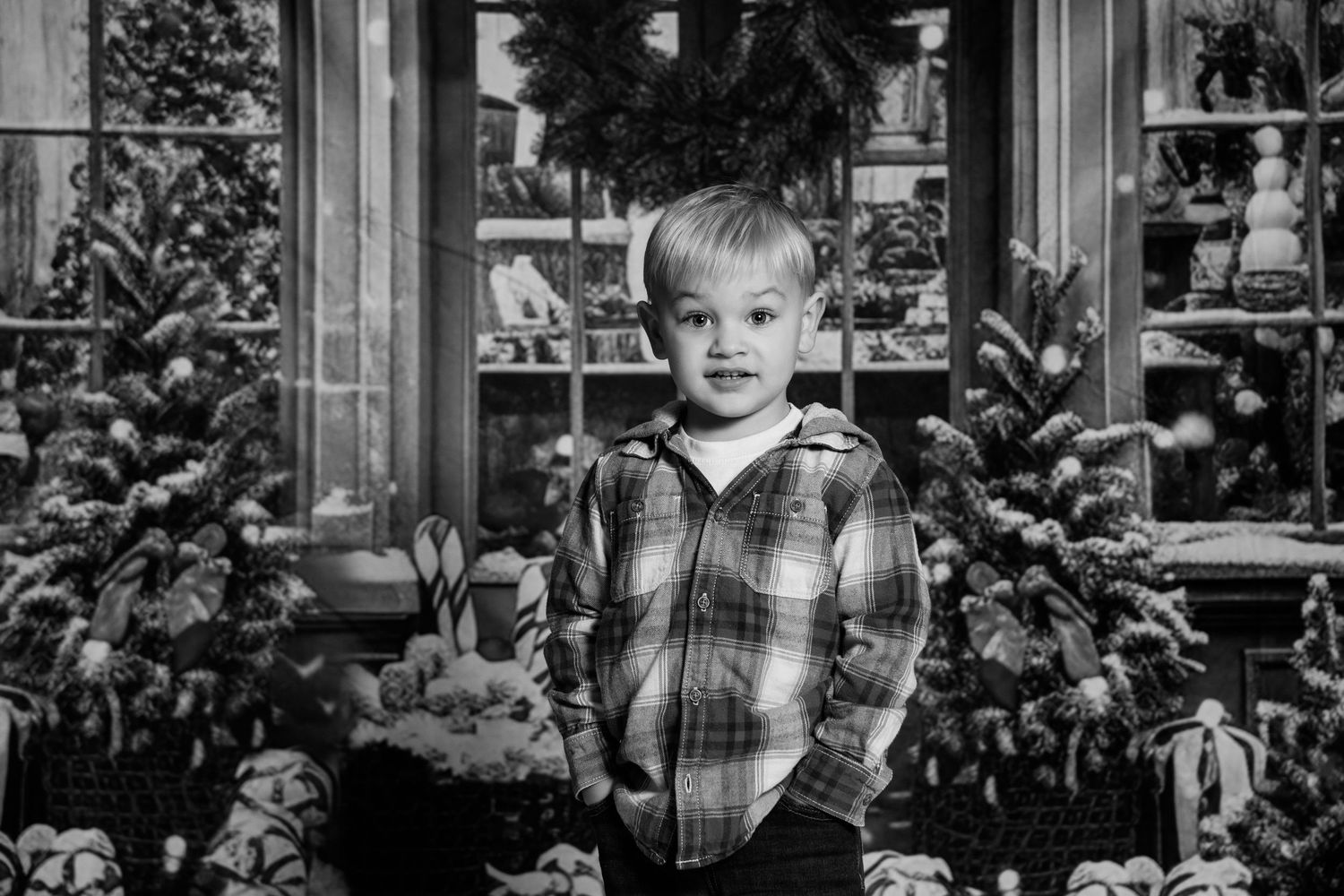 Black and white images of child playing by window with holiday decorations visible.