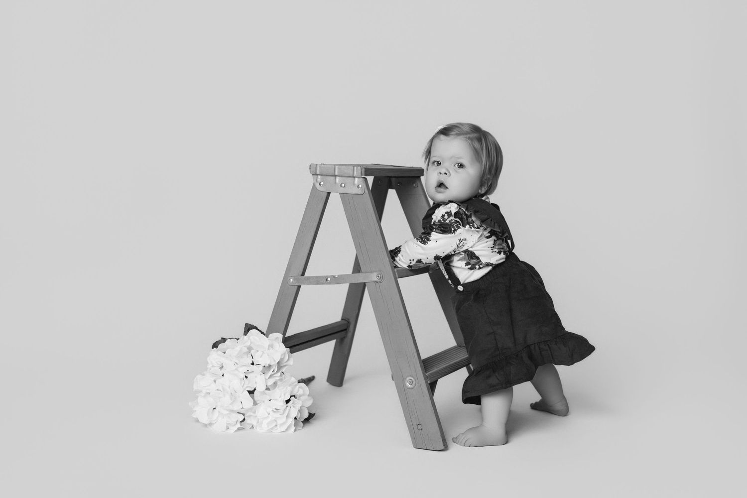 Baby crawling sequence showing different positions on studio floor.