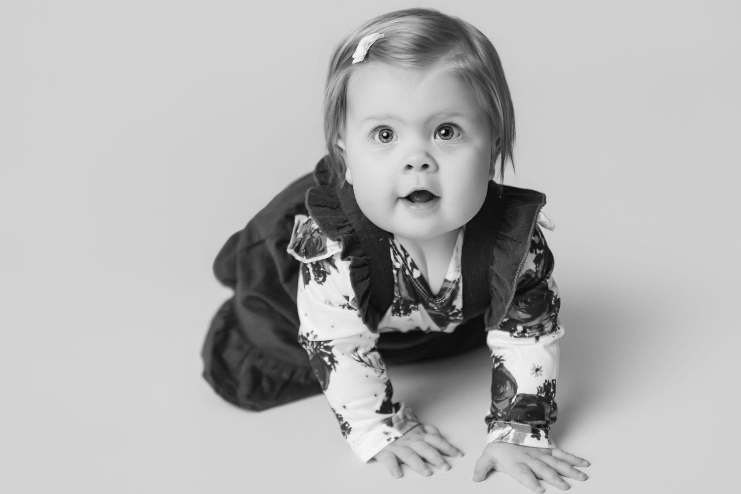 Expressive black and white portrait series showing playful family interactions.